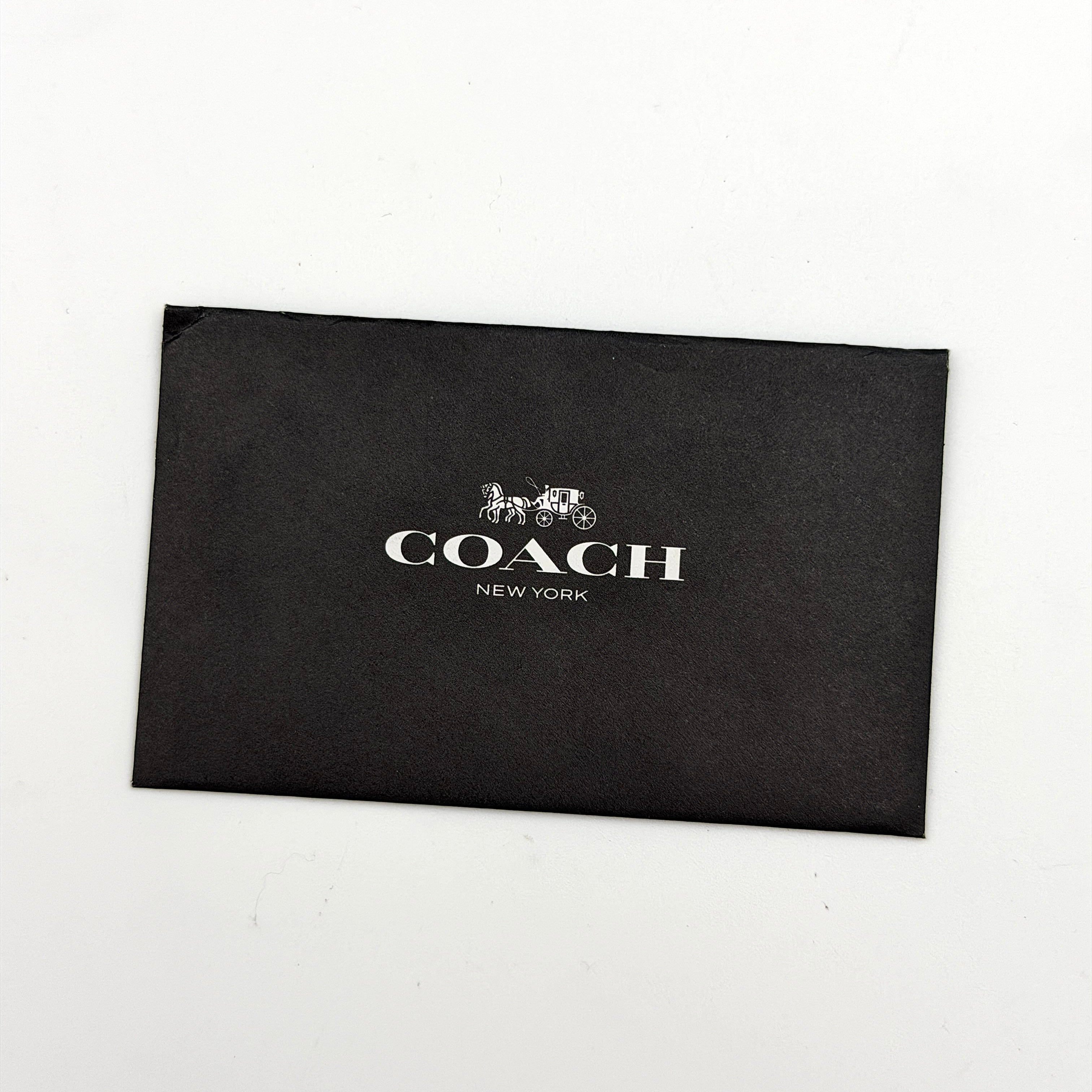 Coach 2Way Courier Carryall in brown and olive green colorblock leather with a structured silhouette, top handle, and detachable strap.