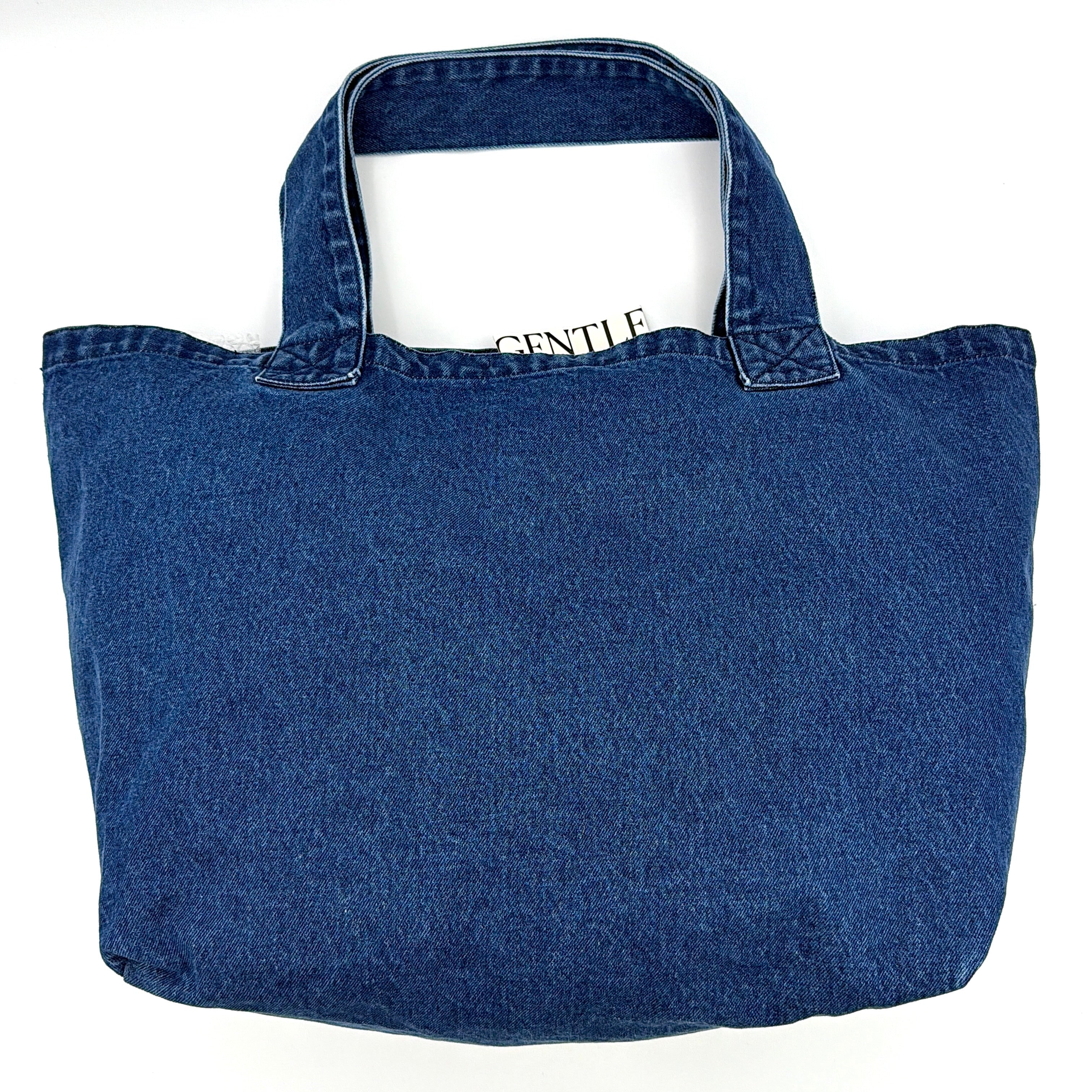 GENTLEWOMAN Jumbo Tote Bag in blue denim with oversized pale blue monogram, featuring sturdy twin handles.