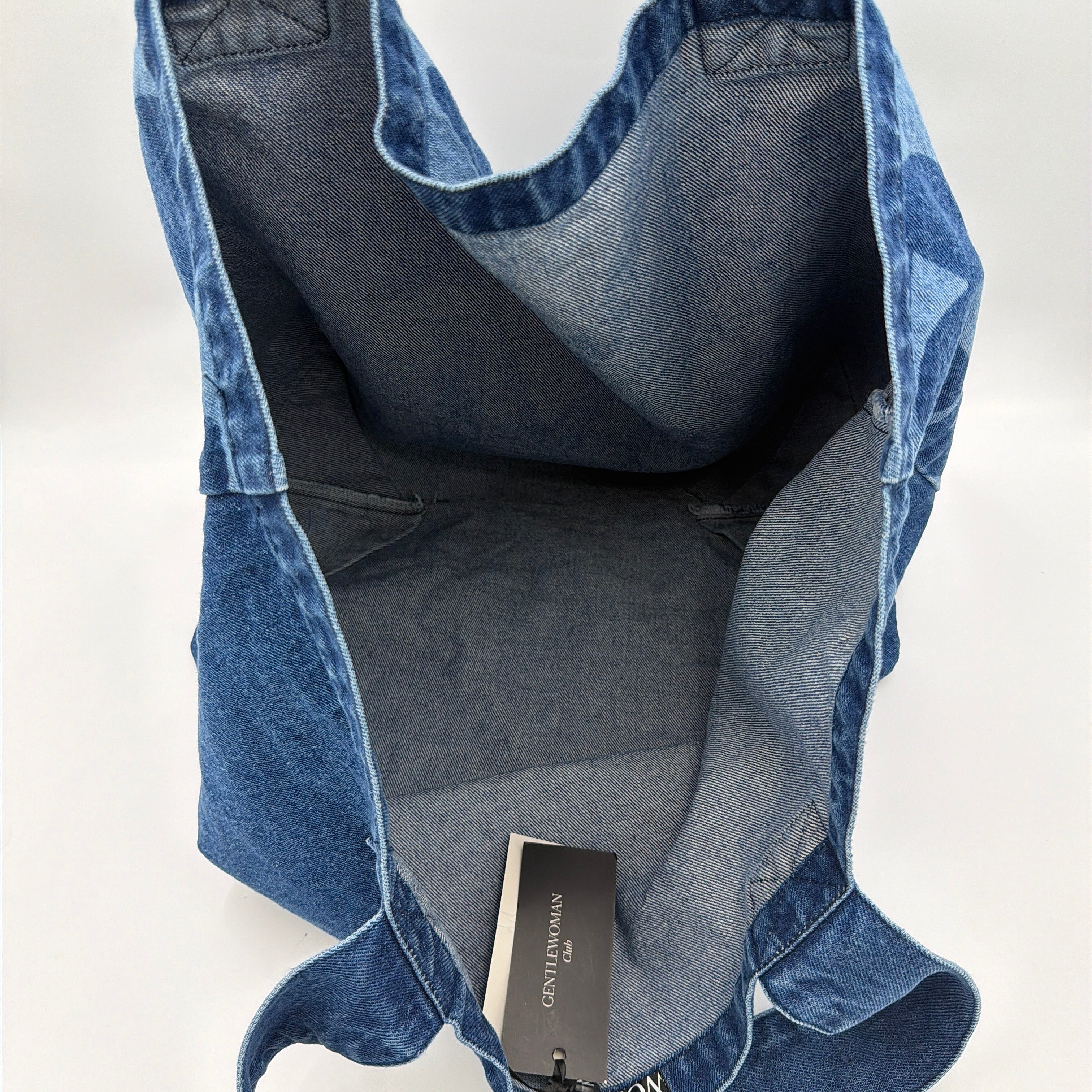GENTLEWOMAN Jumbo Tote Bag in blue denim with oversized pale blue monogram, featuring sturdy twin handles.