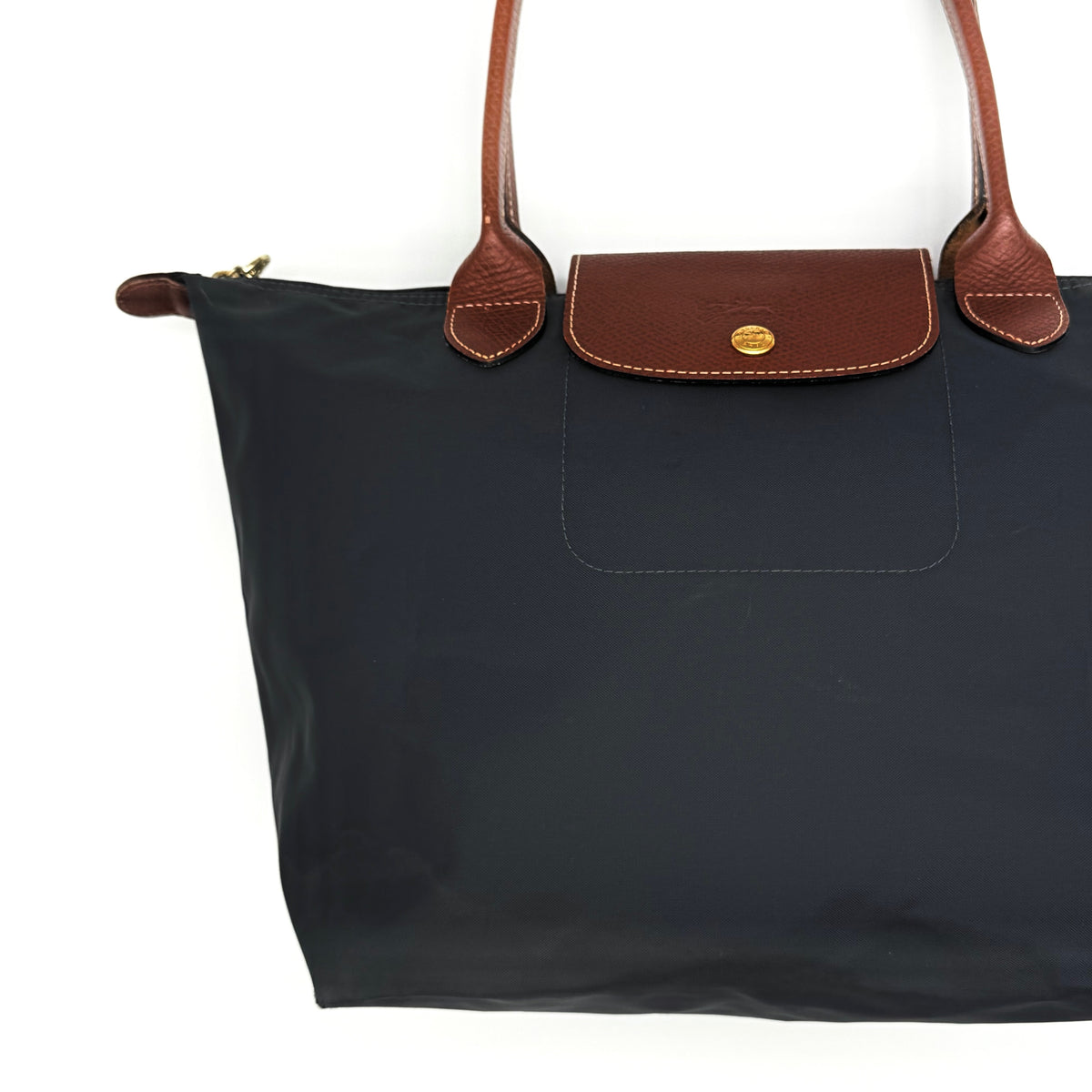 Longchamp Le Pliage Original Tote Bag in grey nylon with brown leather handles and flap, displayed against a white background.