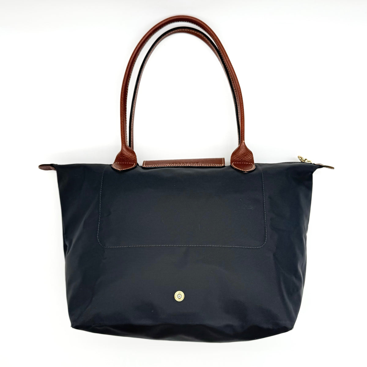 Longchamp Le Pliage Original Tote Bag in grey nylon with brown leather handles and flap, displayed against a white background.