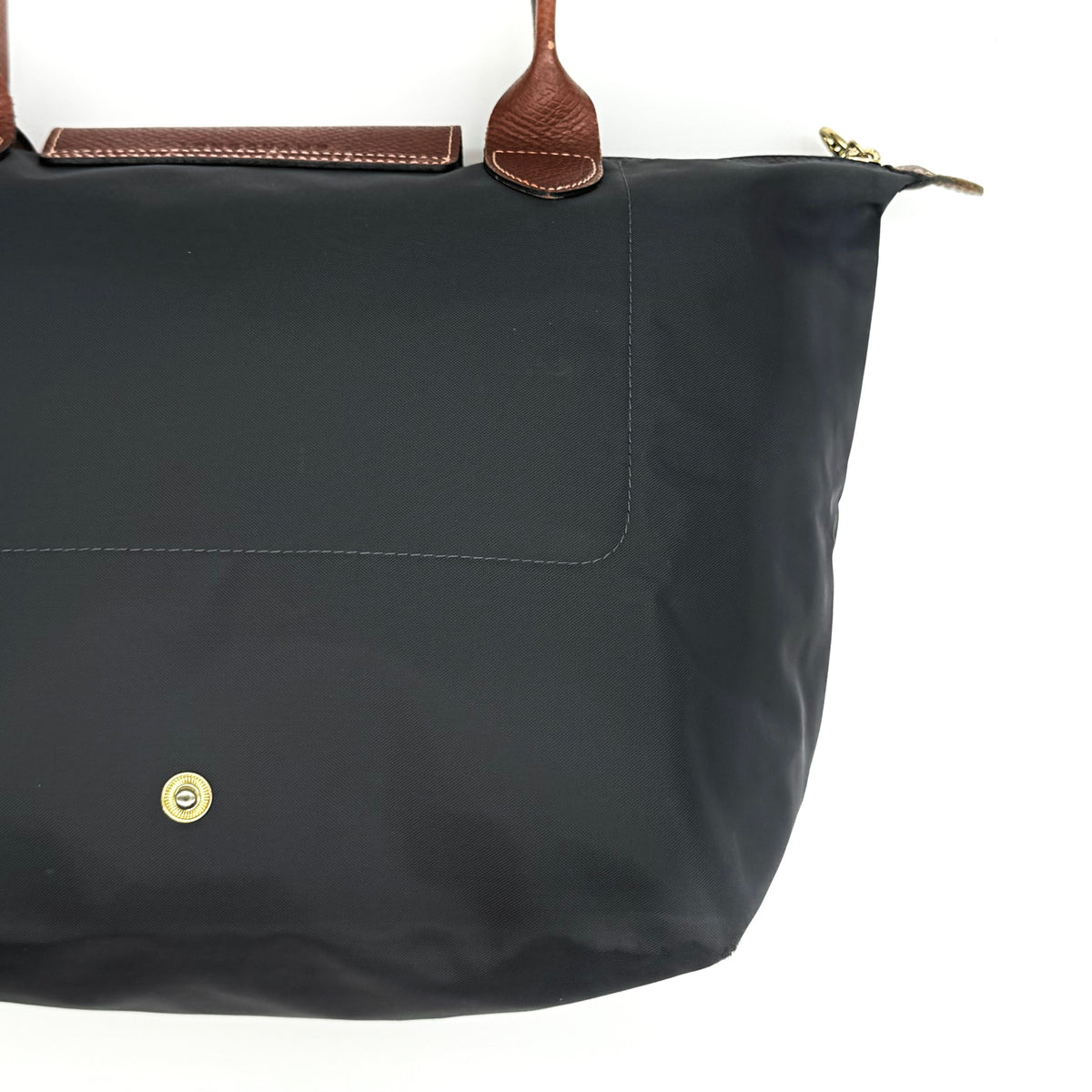 Longchamp Le Pliage Original Tote Bag in grey nylon with brown leather handles and flap, displayed against a white background.