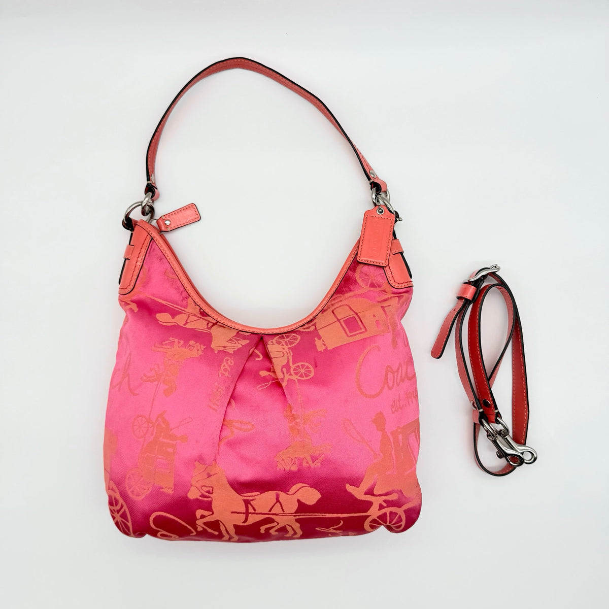 Coach pink and orange Horse & Carriage sateen hobo shoulder bag with detachable strap and leather trim.