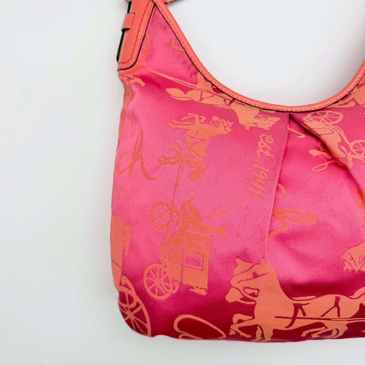 Coach pink and orange Horse & Carriage sateen hobo shoulder bag with detachable strap and leather trim.