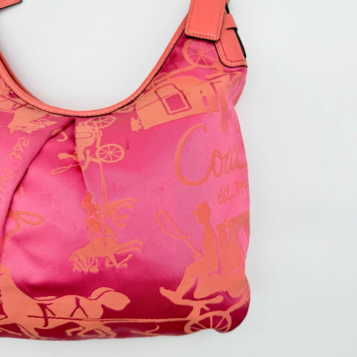 Coach pink and orange Horse & Carriage sateen hobo shoulder bag with detachable strap and leather trim.