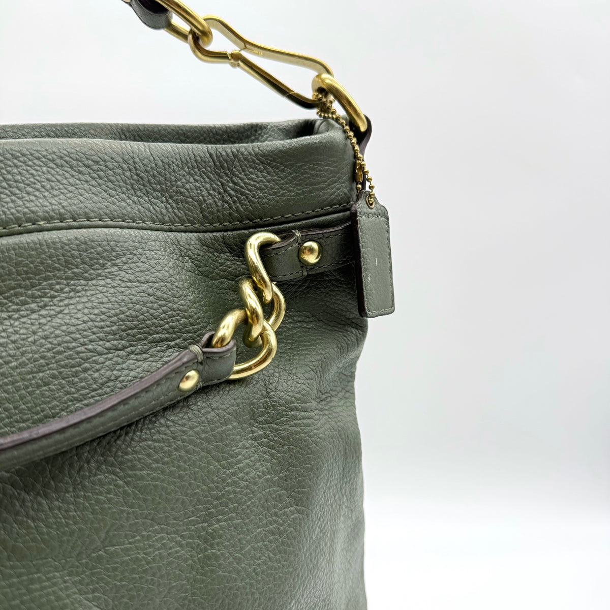 Coach Brooke Large Hobo Shoulder Bag in olive green pebbled leather with brass hardware, shown on a white background.