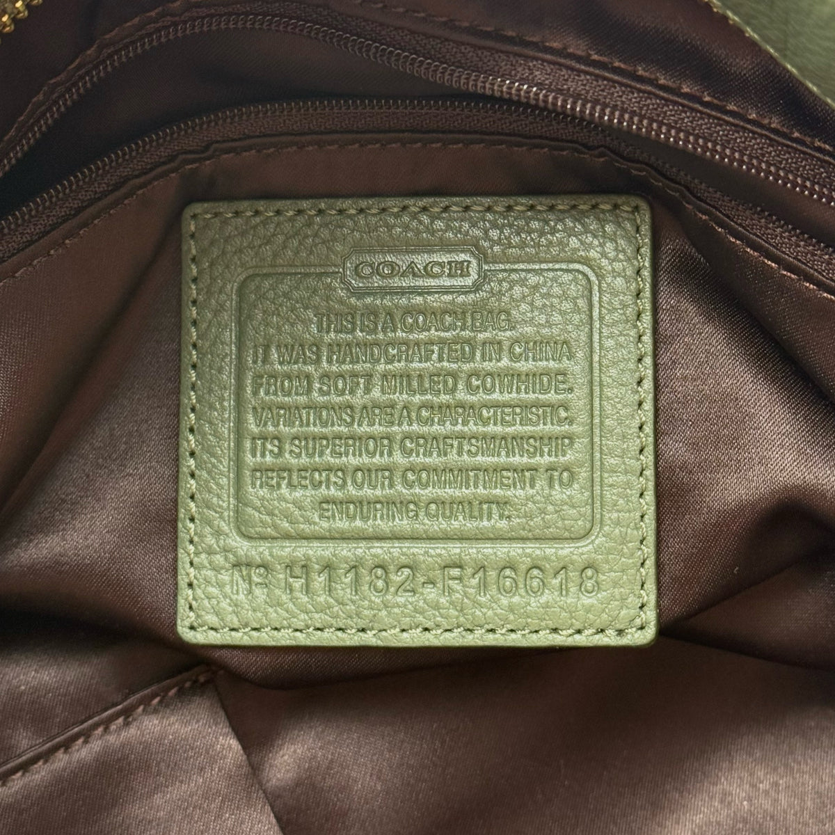 Coach Brooke Large Hobo Shoulder Bag in olive green pebbled leather with brass hardware, shown on a white background.