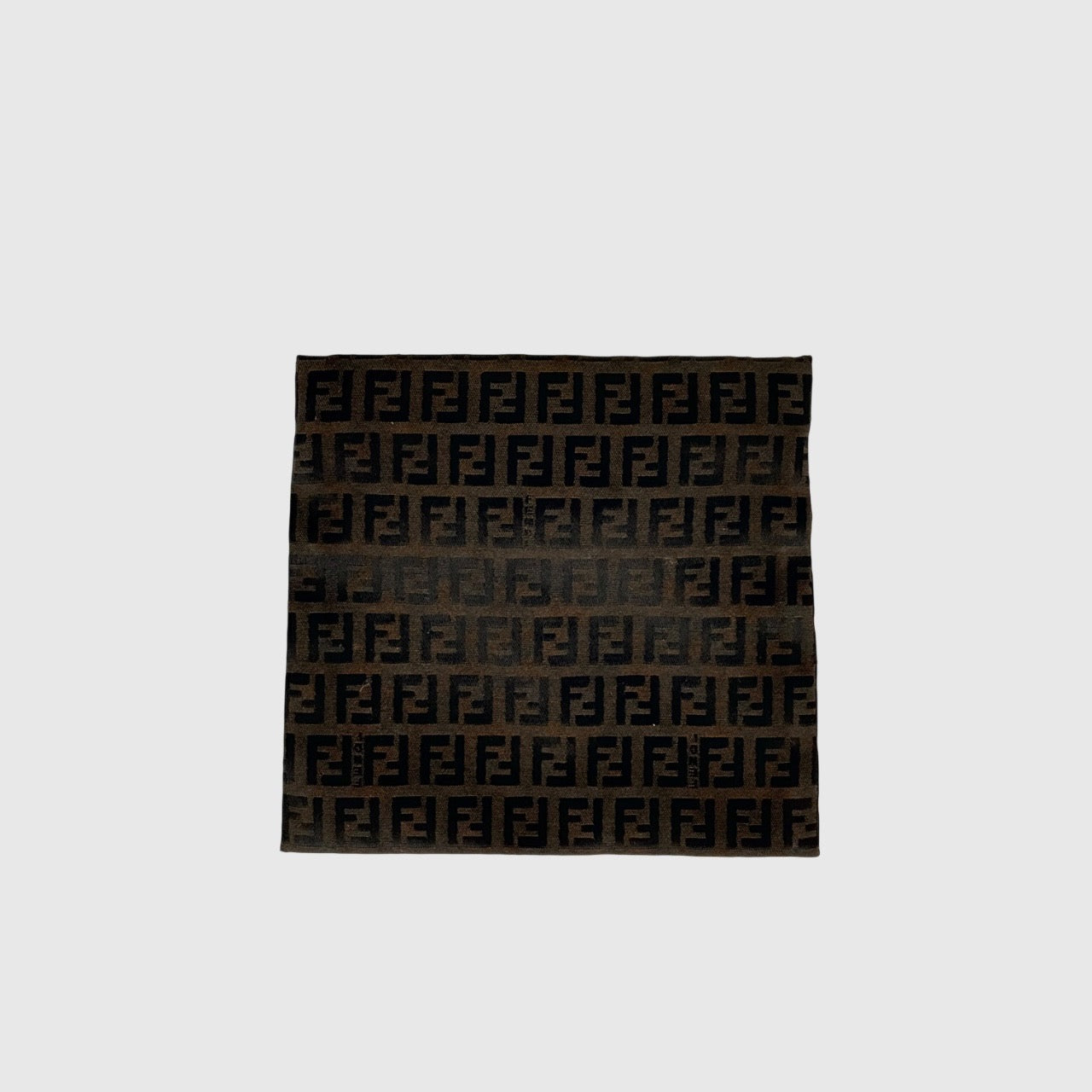 The Fendi FF Zucca Pouch in brown canvas, featuring an all-over FF logo pattern and silver-tone zip closure.
