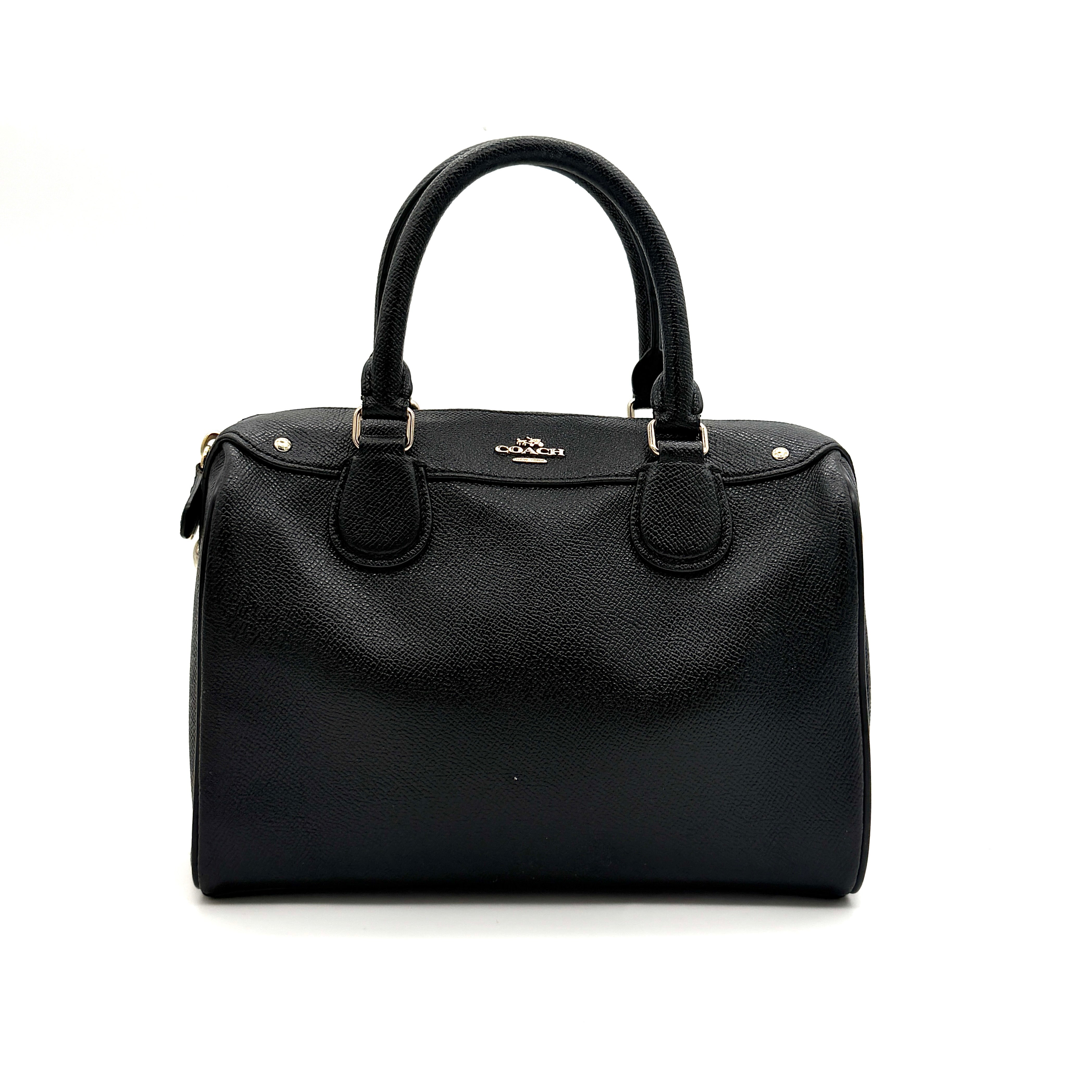 Front-facing image of the Coach Mini Bennett Boston Bag in black grained leather with gold hardware.