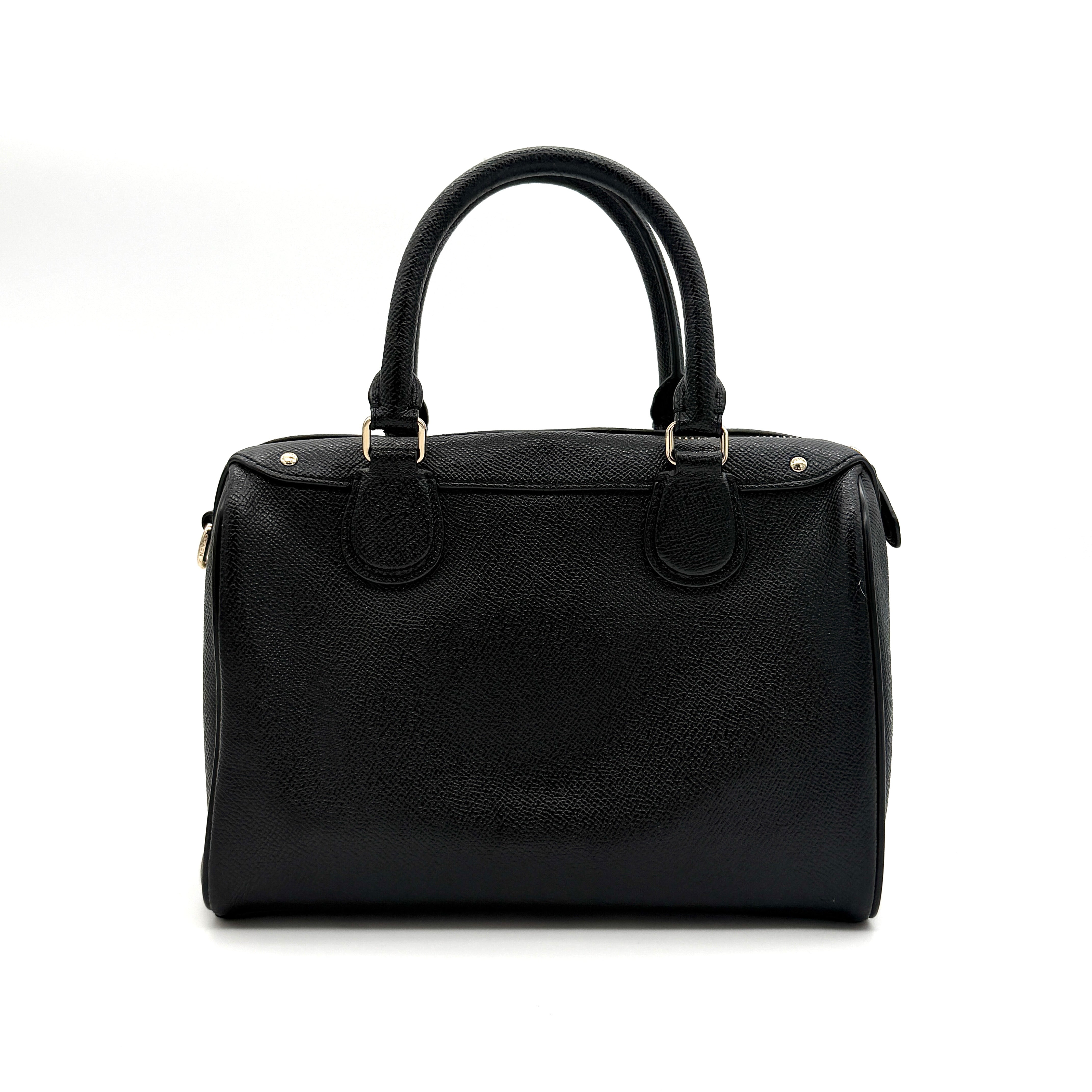 Front-facing image of the Coach Mini Bennett Boston Bag in black grained leather with gold hardware.