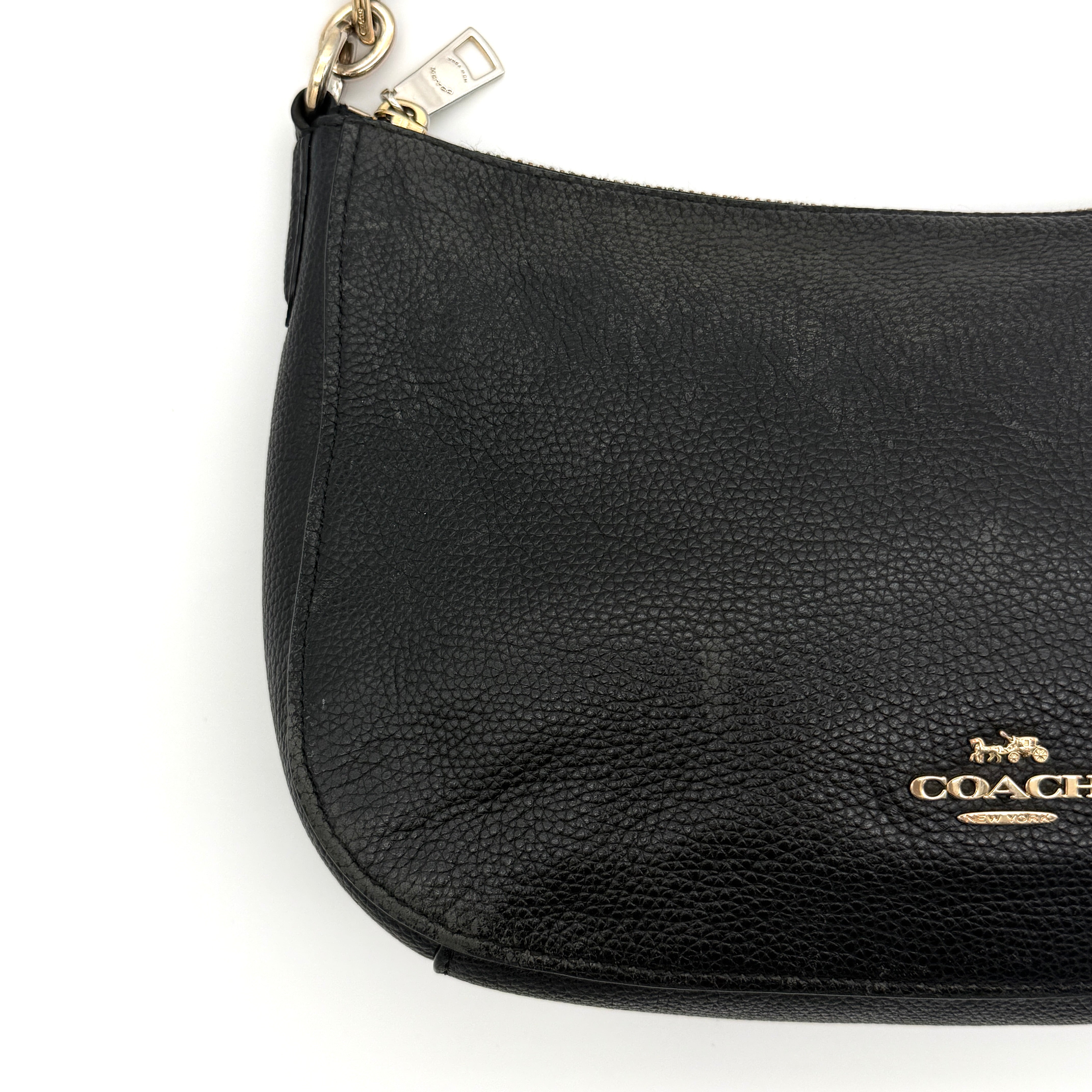 Coach Sutton Hobo Shoulder Bag in black grained leather with gold-tone hardware and zip closure.