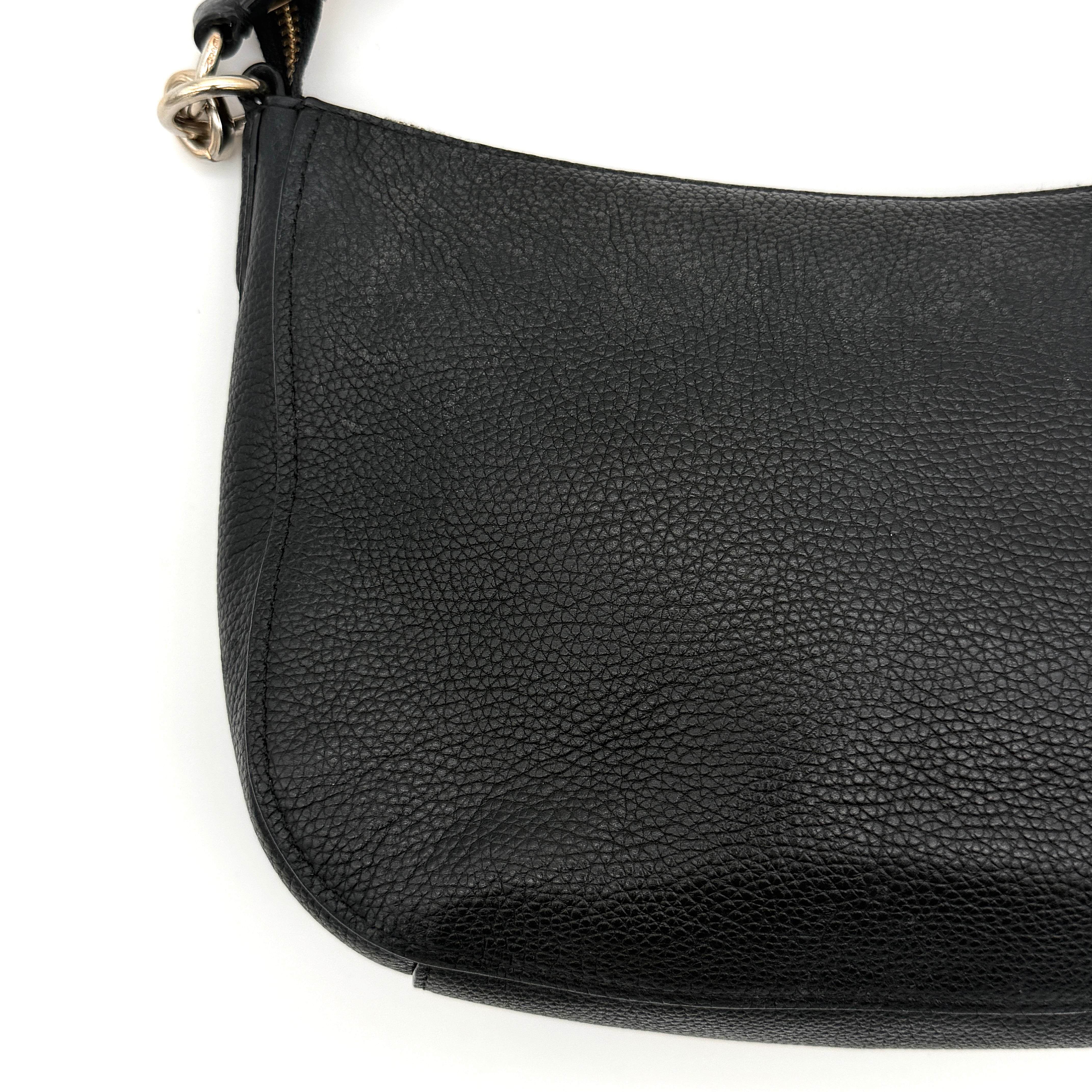 Coach Sutton Hobo Shoulder Bag in black grained leather with gold-tone hardware and zip closure.