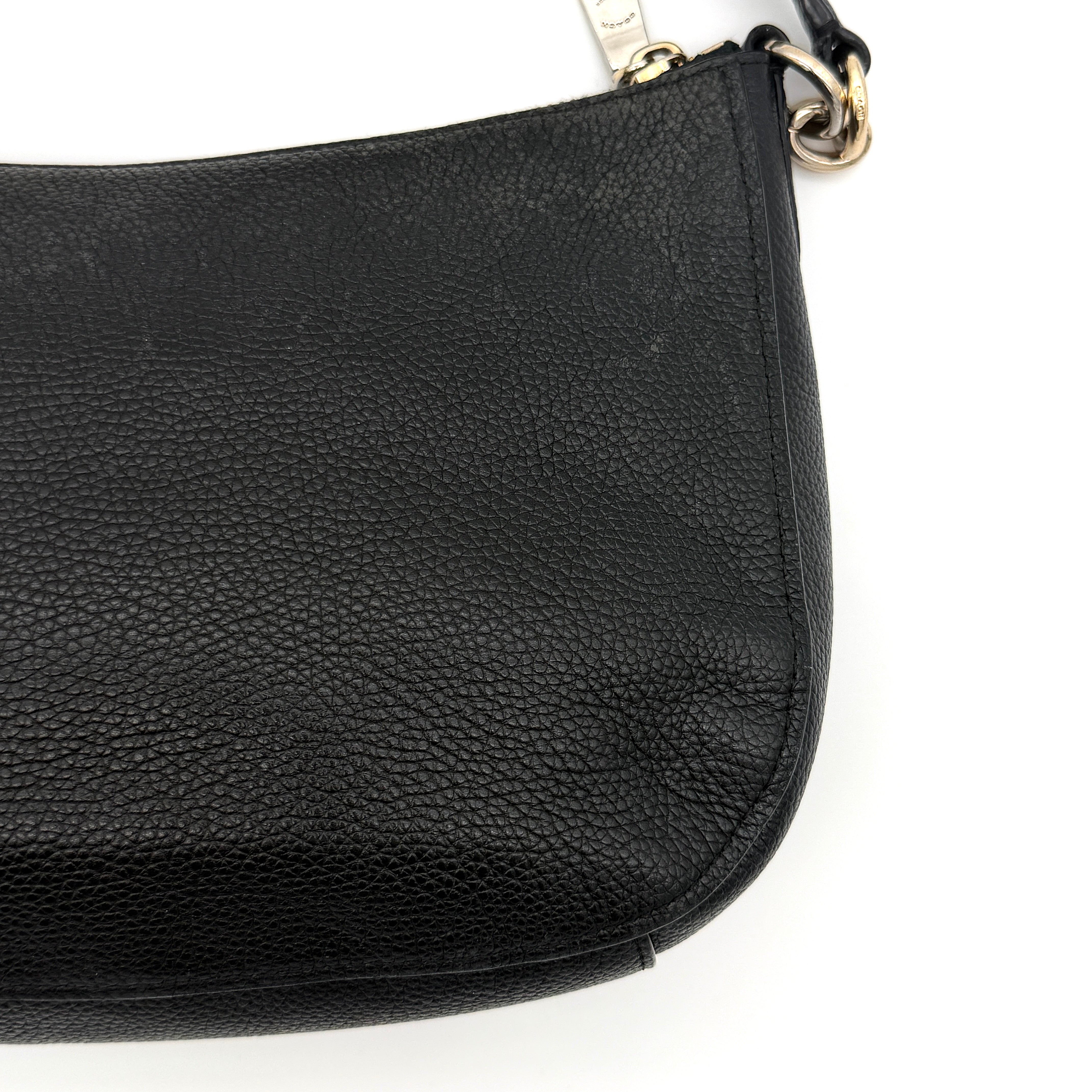 Coach Sutton Hobo Shoulder Bag in black grained leather with gold-tone hardware and zip closure.