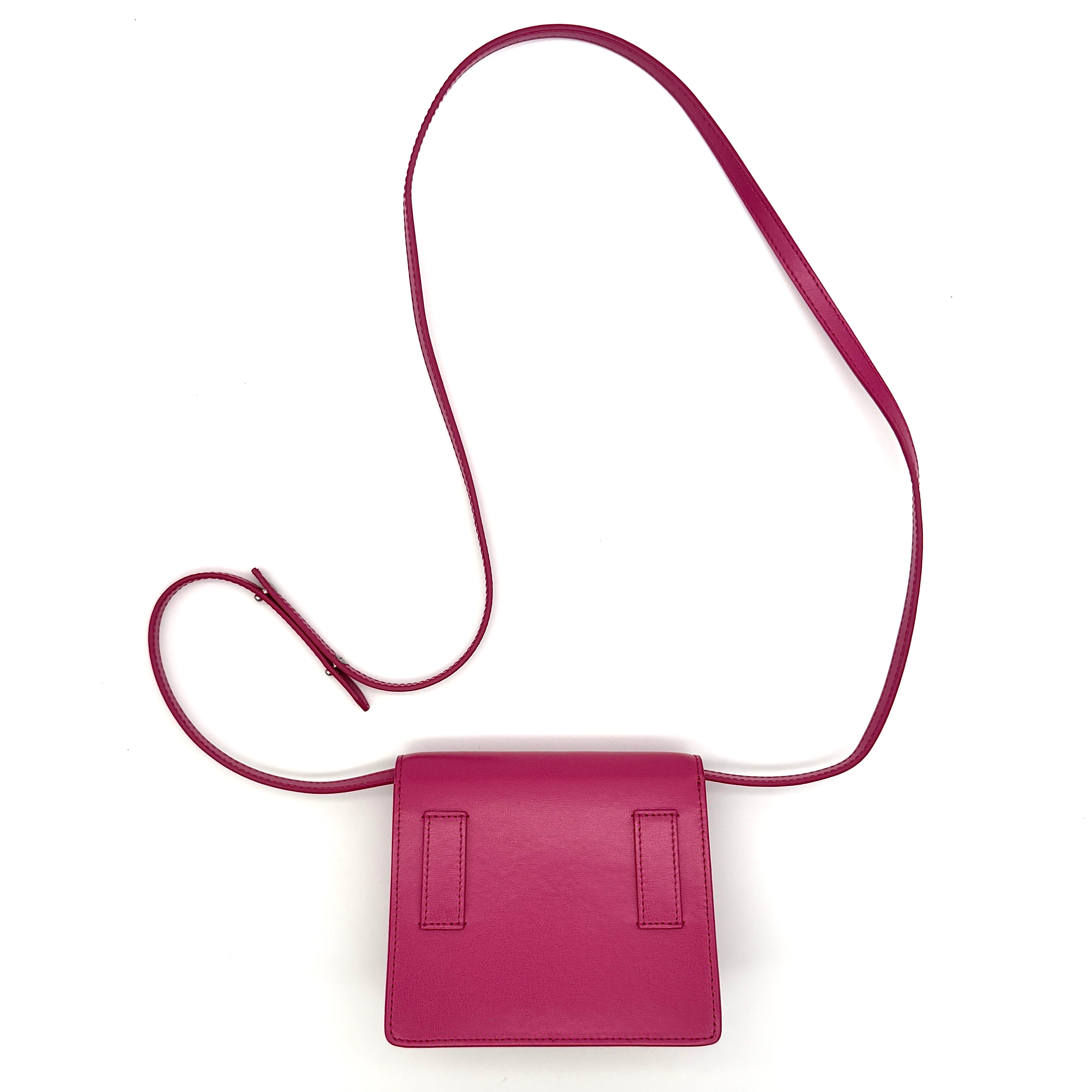 Off-White Jitney 0.7 Crossbody Bag in pink leather with silver-tone arrow logo and adjustable strap, shown against a white background.