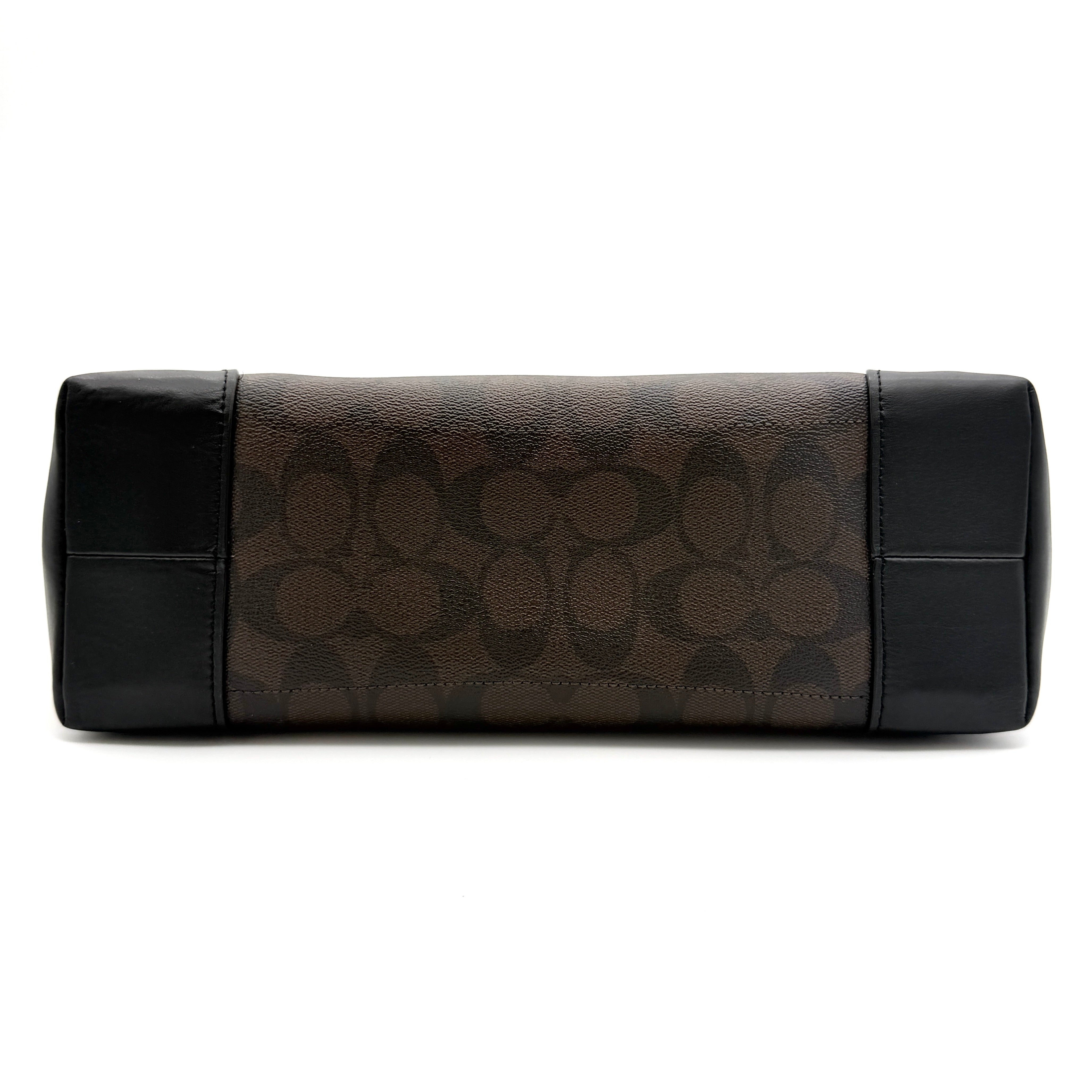 Coach Signature Zip Top Tote Bag in brown and black canvas with leather trim and gold-tone hardware.