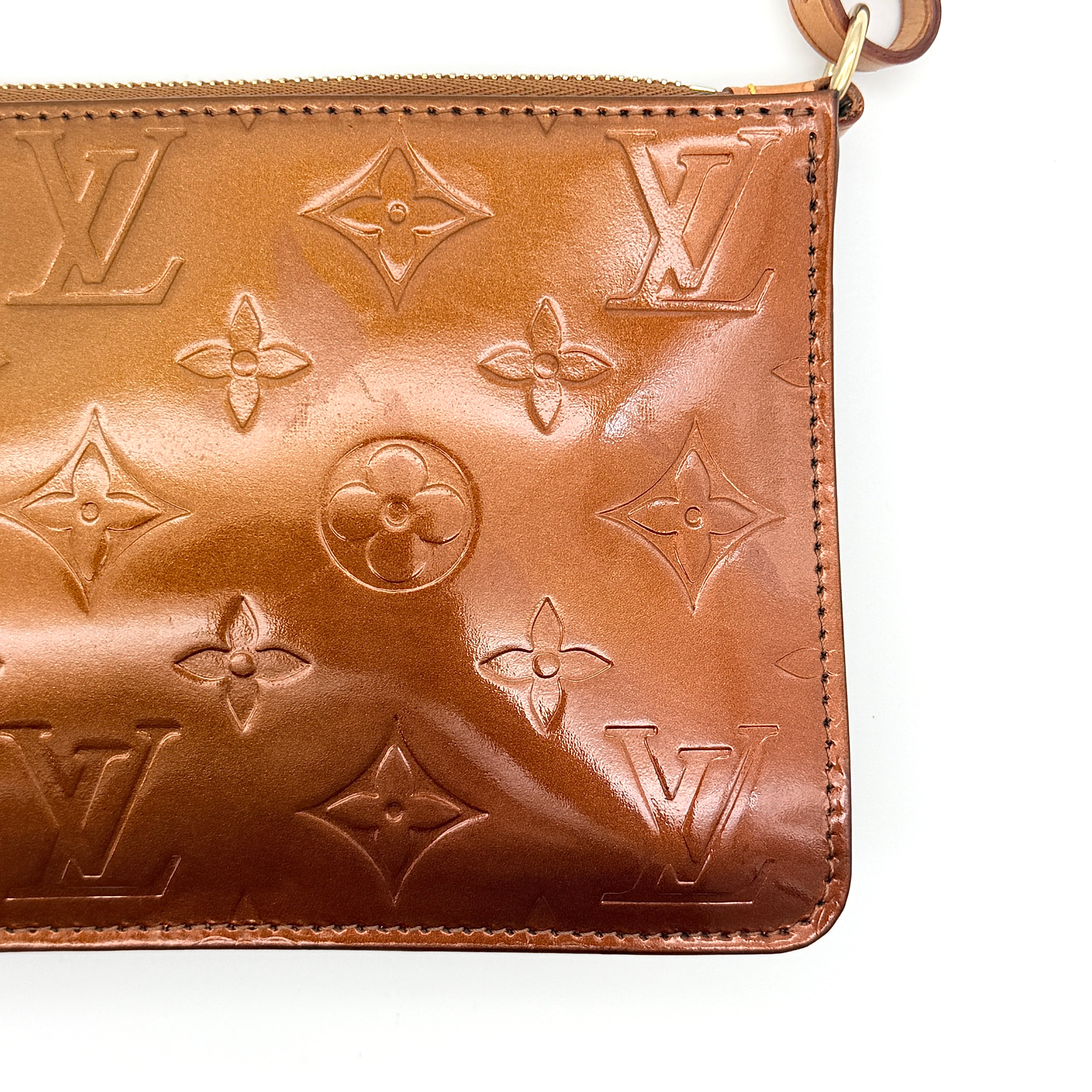 Louis Vuitton Monogram Lexington Vernis Pochette in bronze patent leather, shown with its gold-tone hardware and monogram embossing.