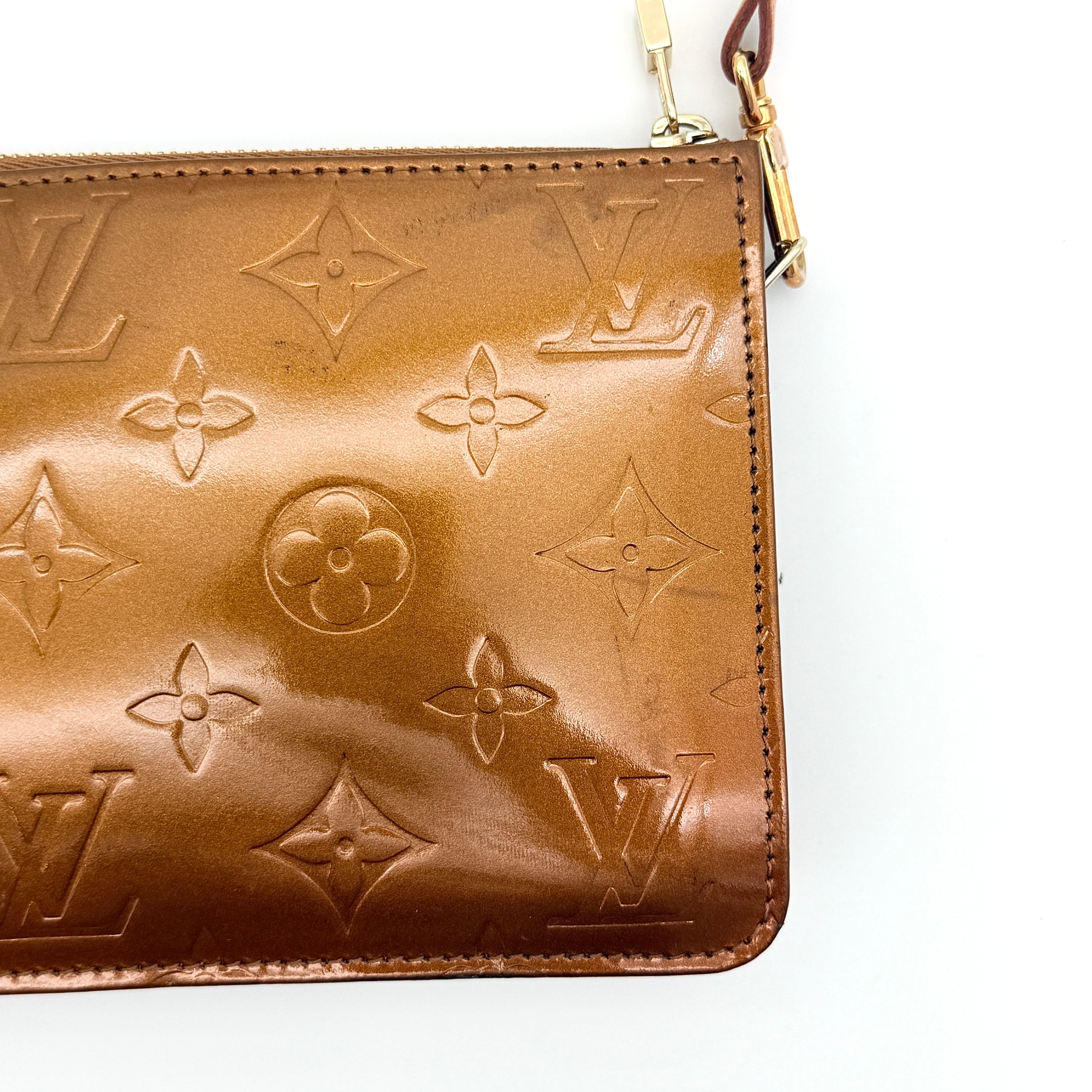 Louis Vuitton Monogram Lexington Vernis Pochette in bronze patent leather, shown with its gold-tone hardware and monogram embossing.
