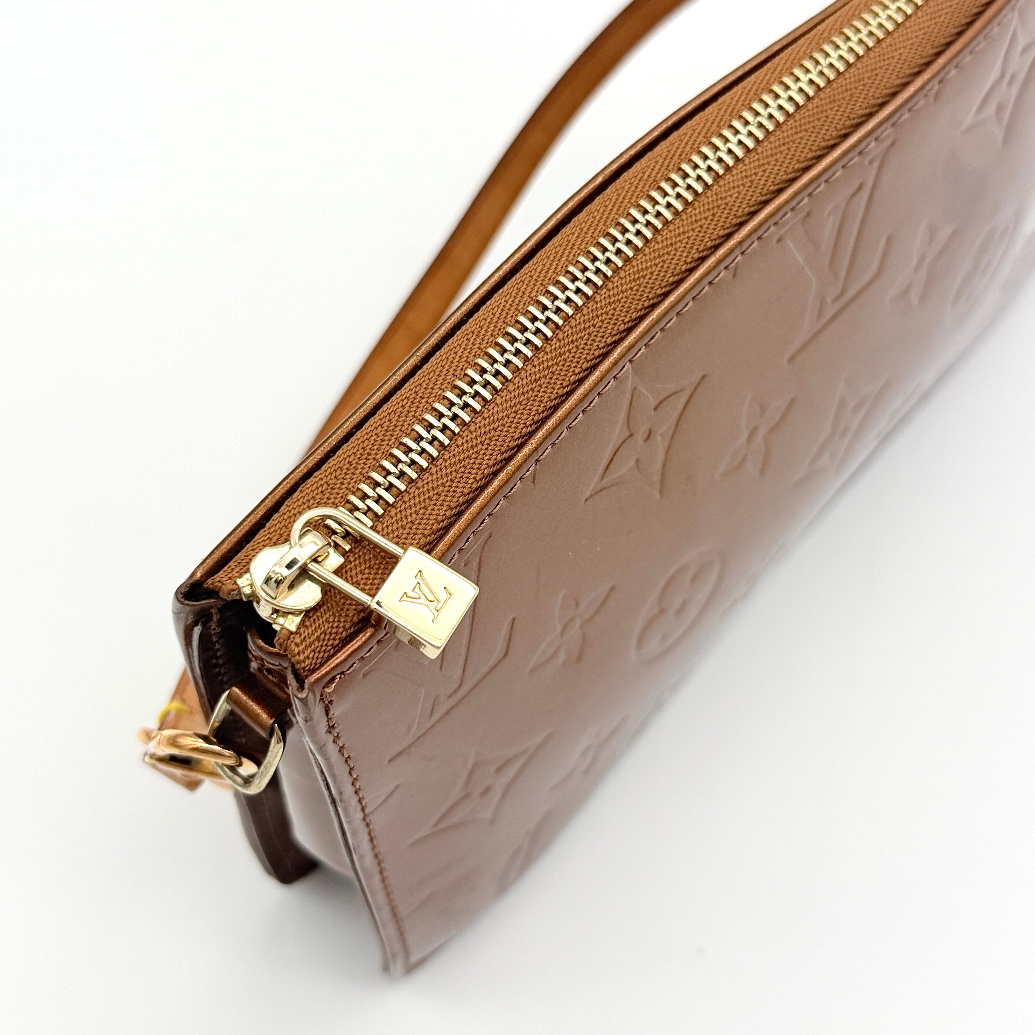 Louis Vuitton Monogram Lexington Vernis Pochette in bronze patent leather, shown with its gold-tone hardware and monogram embossing.