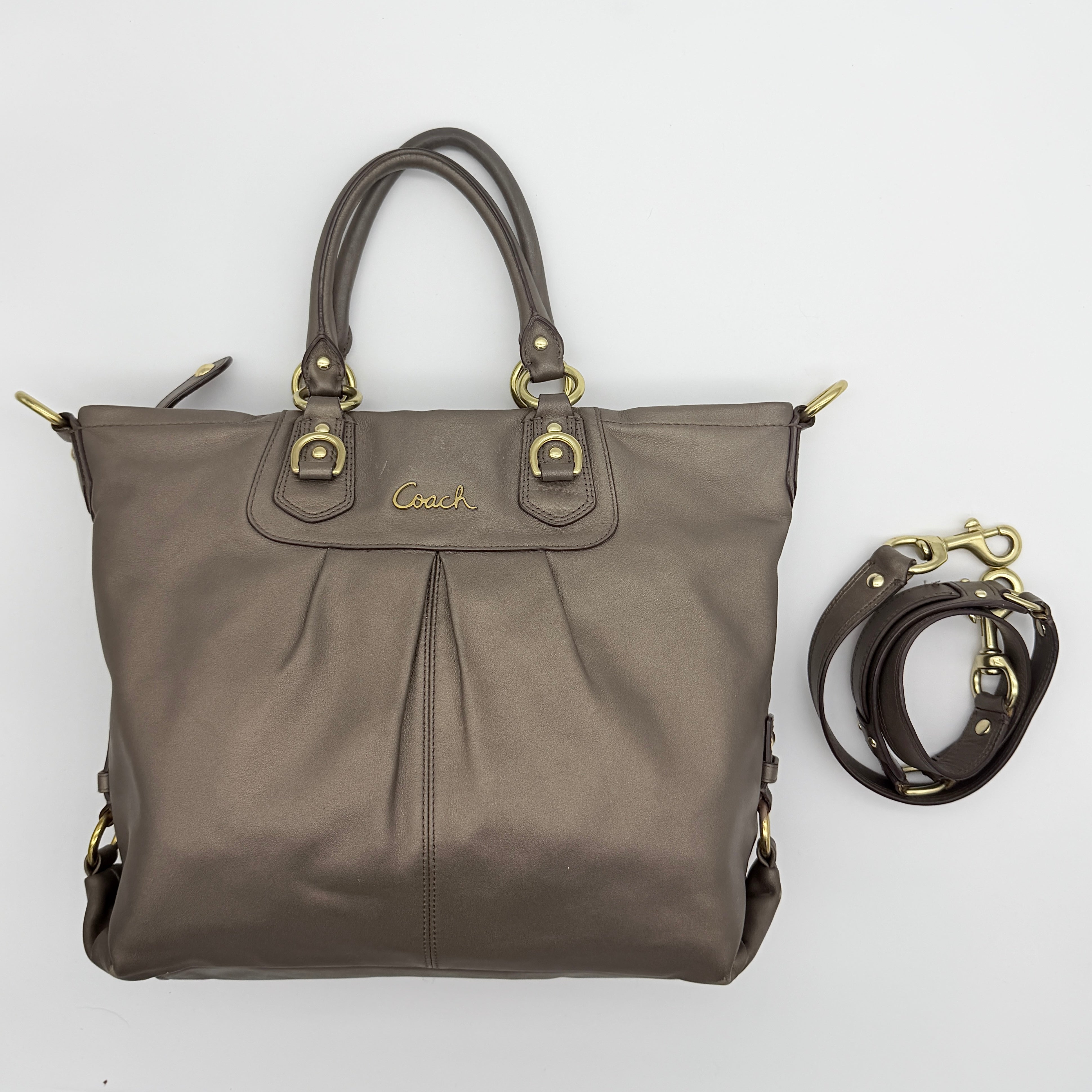 Coach Ashley 2Way shoulder bag in grey leather with gold-tone hardware and detachable strap, displayed against a white background.