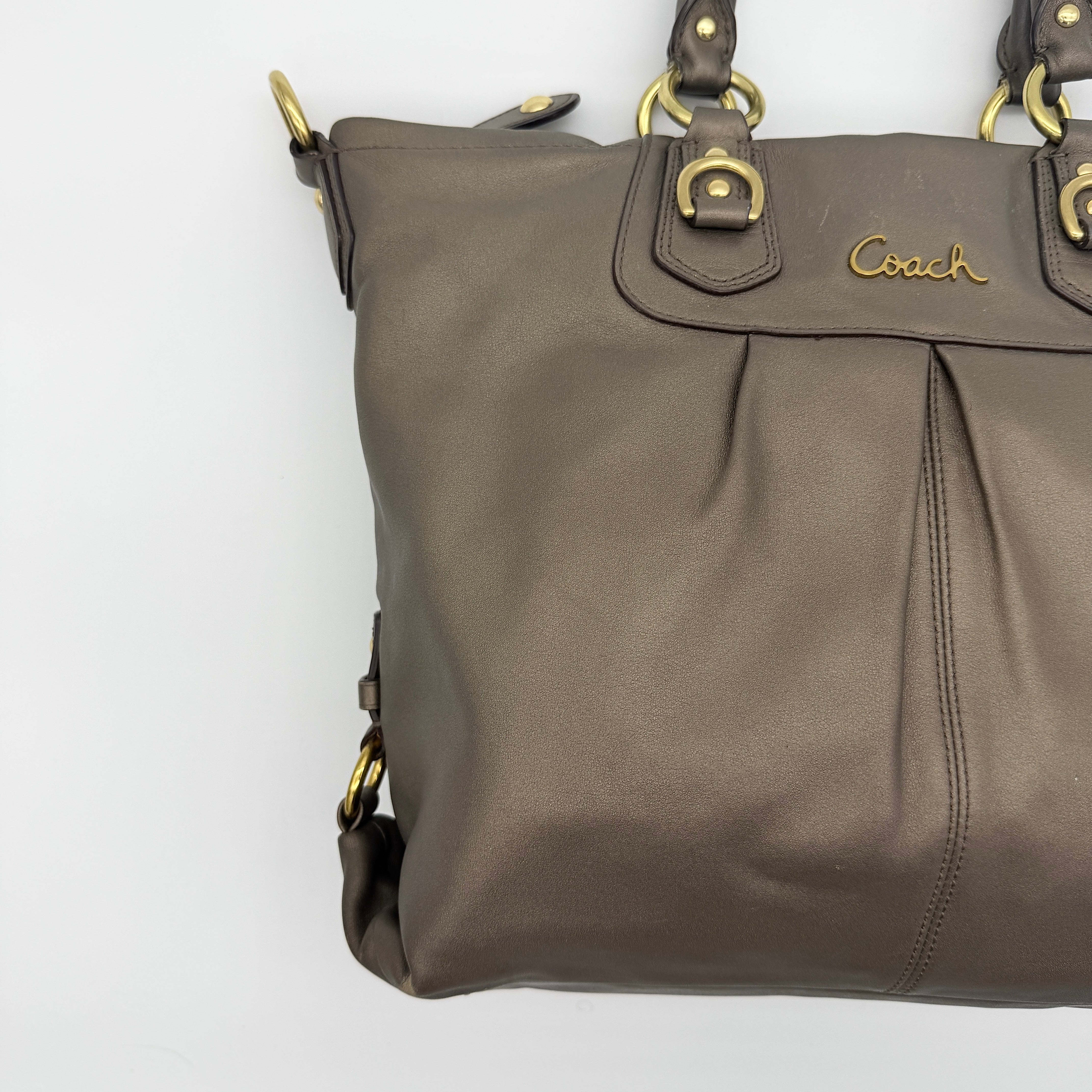 Coach Ashley 2Way shoulder bag in grey leather with gold-tone hardware and detachable strap, displayed against a white background.
