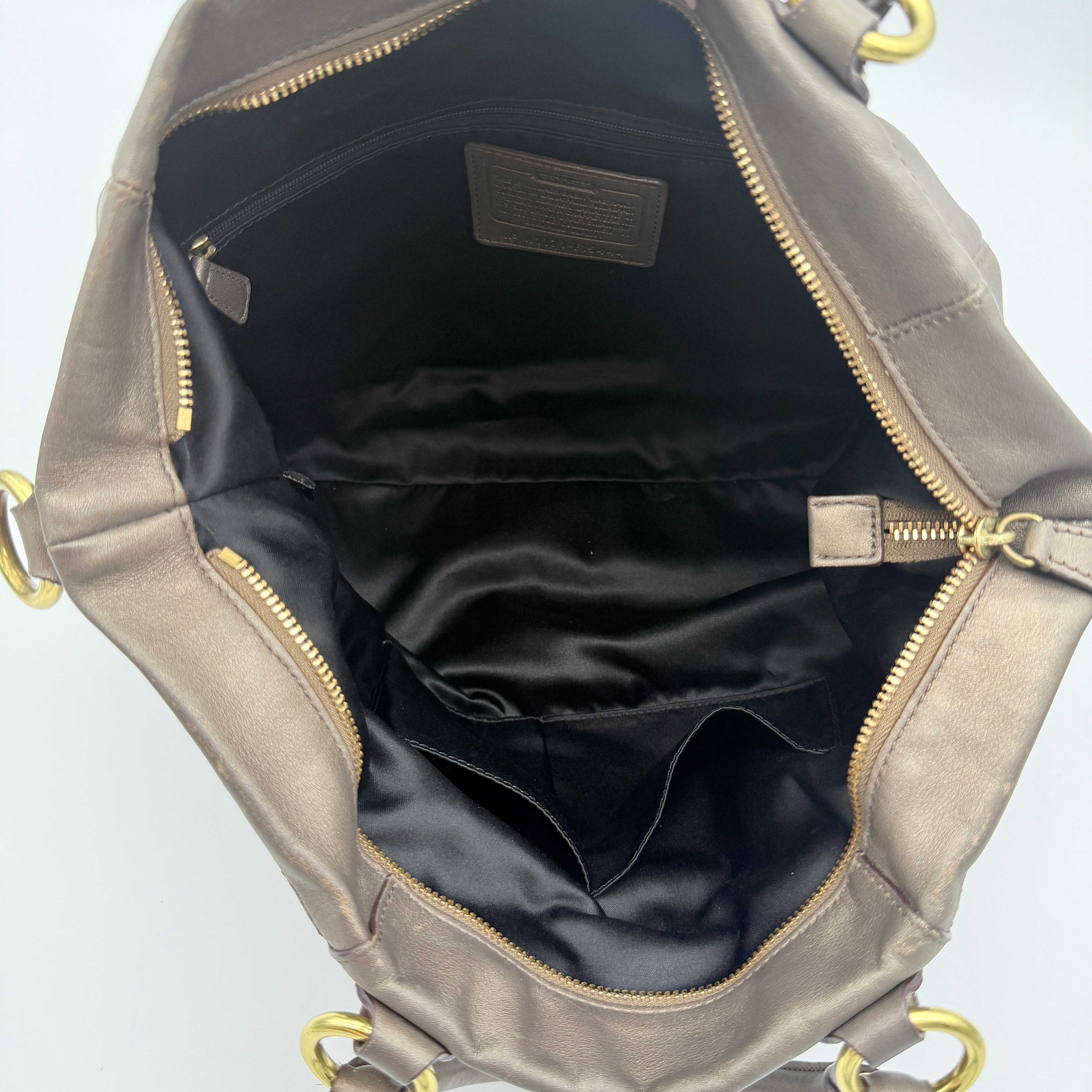 Coach Ashley 2Way shoulder bag in grey leather with gold-tone hardware and detachable strap, displayed against a white background.