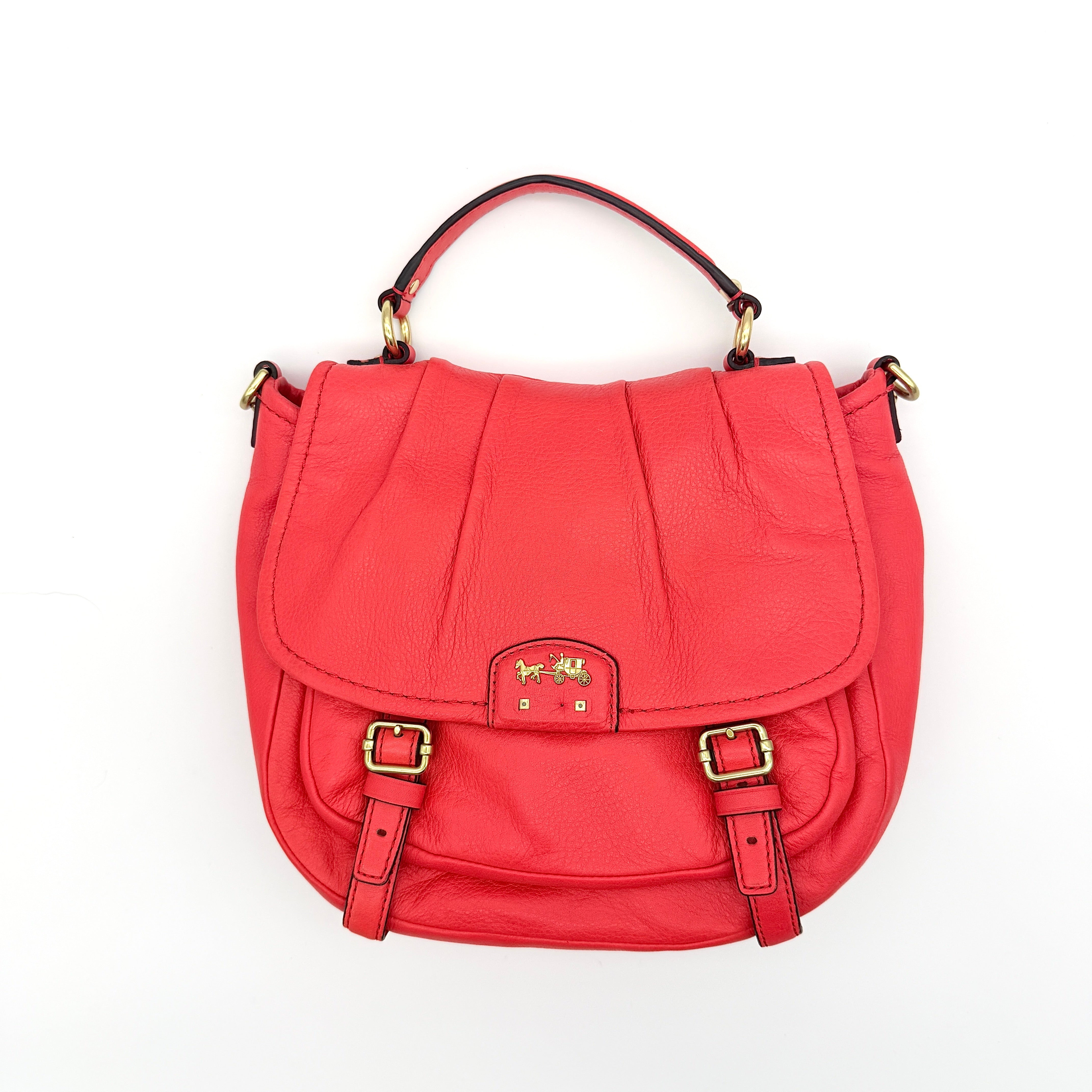 Coach Madison Anabelle red leather handbag with gold tone hardware, top handle, and detachable strap displayed on a white background