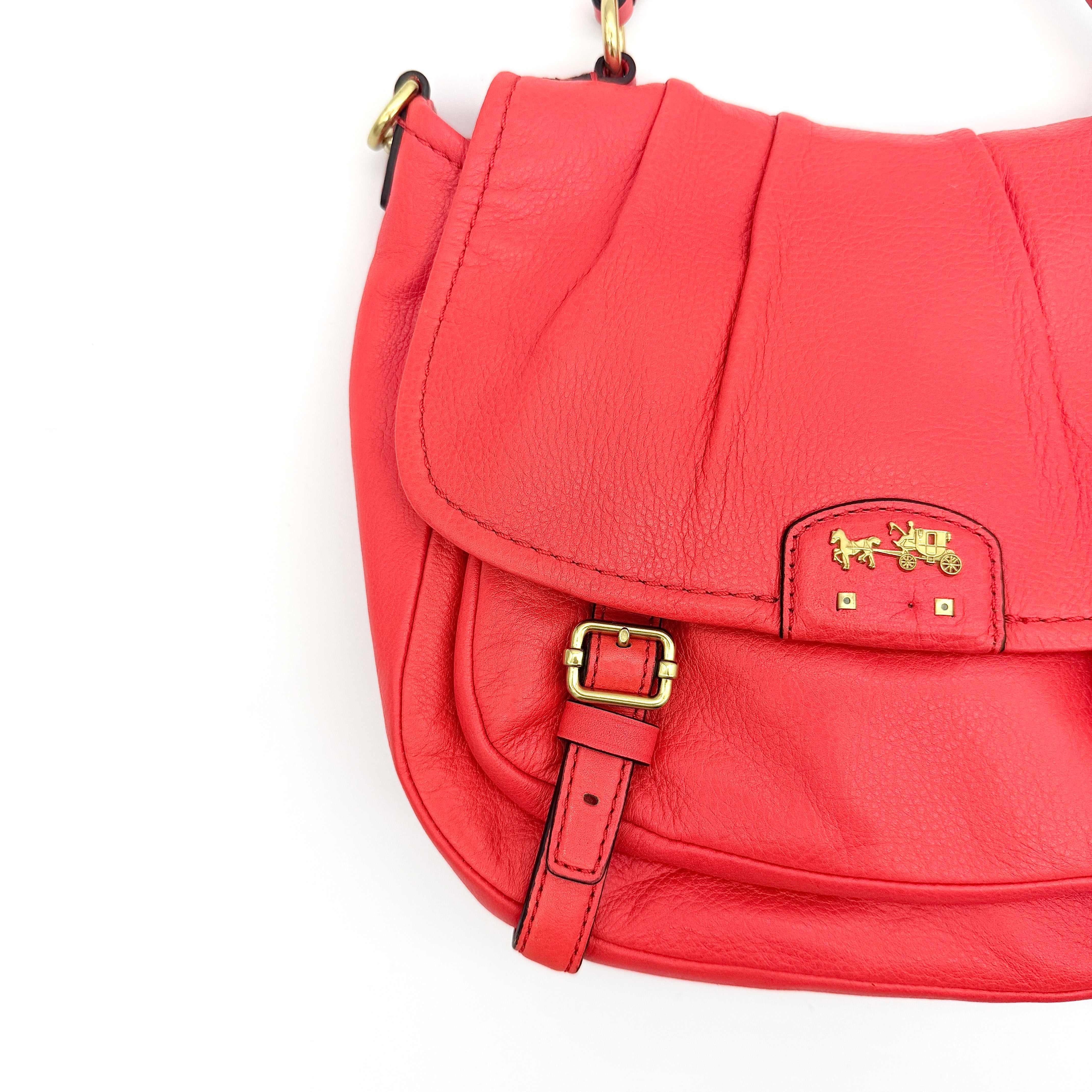 Coach Madison Anabelle red leather handbag with gold tone hardware, top handle, and detachable strap displayed on a white background