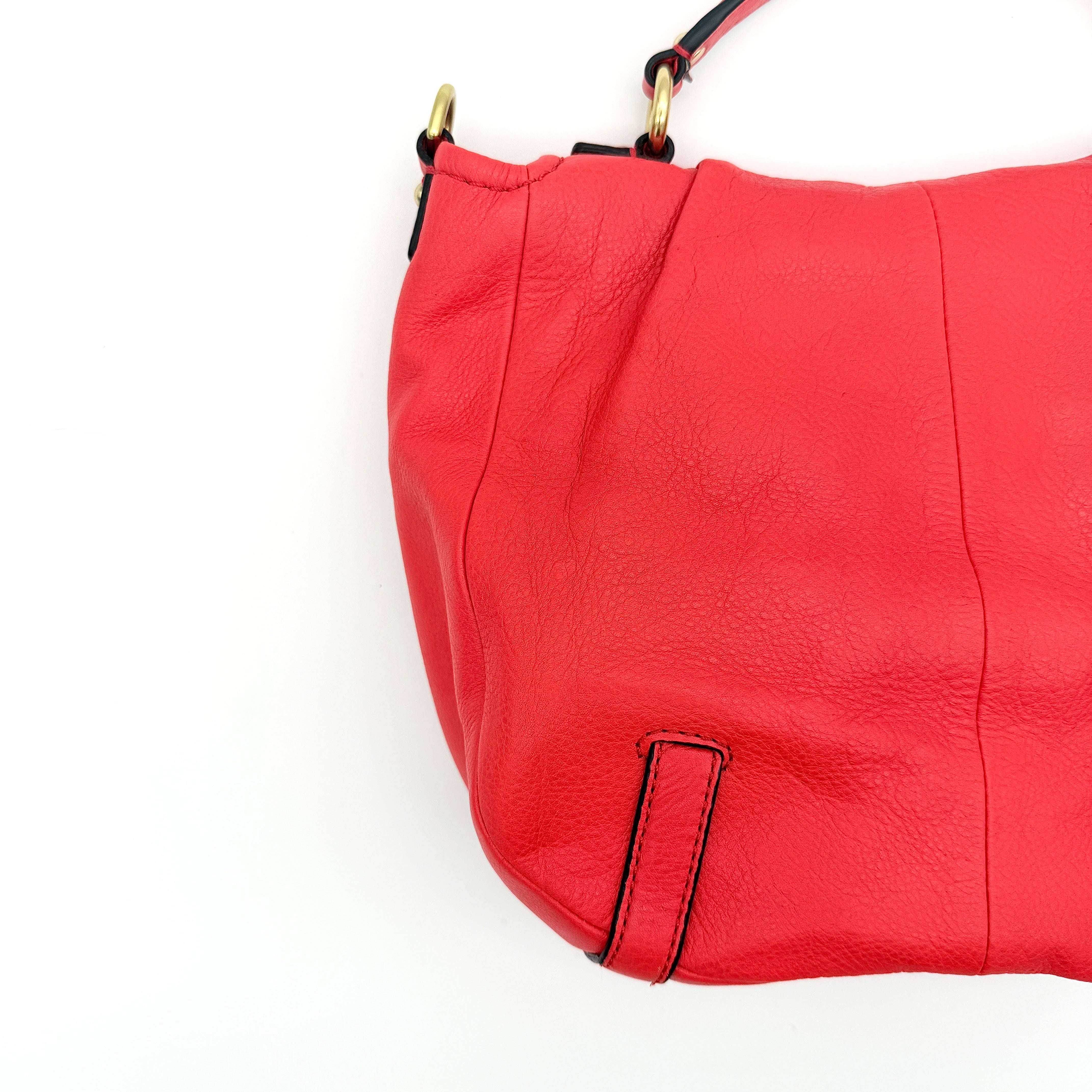 Coach Madison Anabelle red leather handbag with gold tone hardware, top handle, and detachable strap displayed on a white background