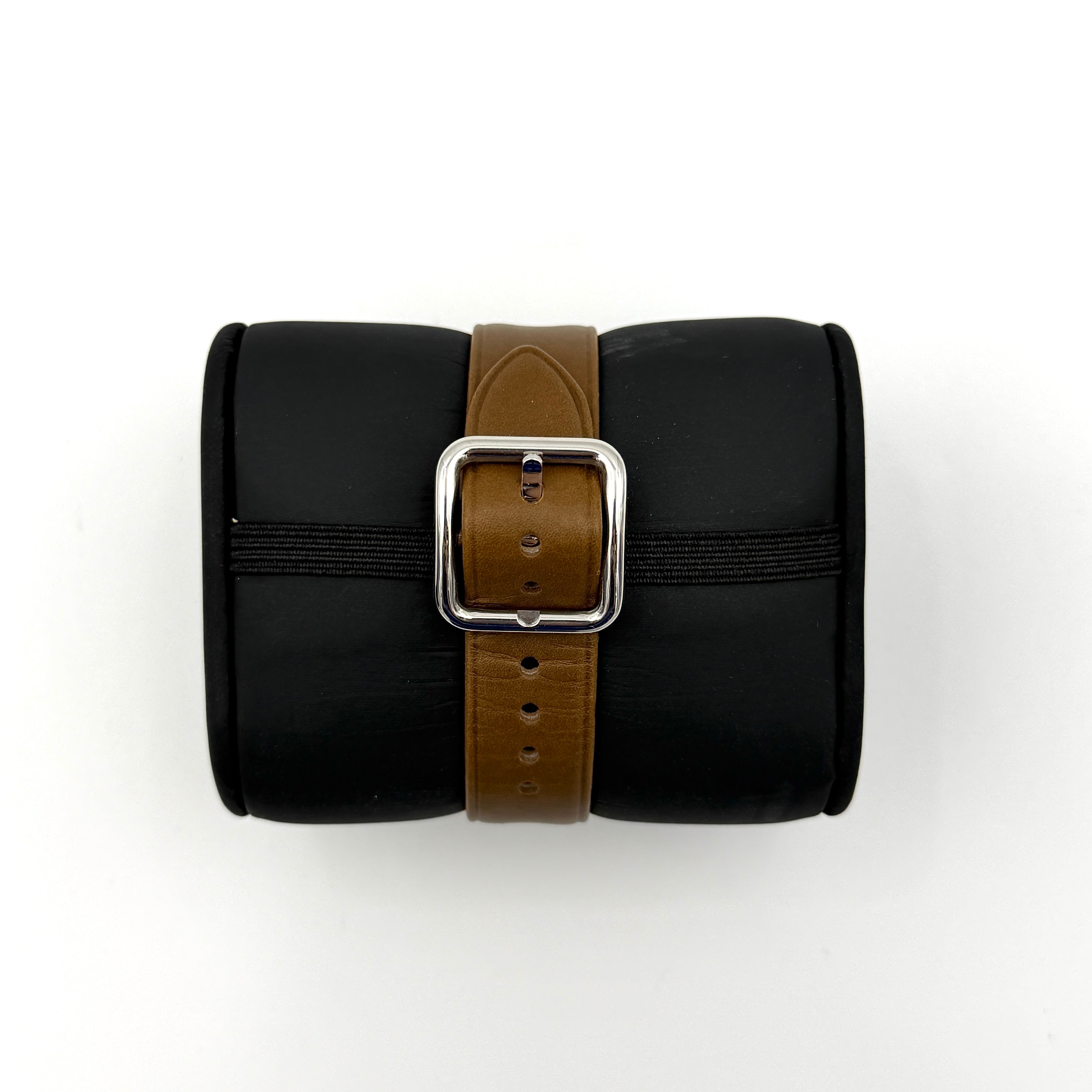 Marc Jacobs MJ1436 silver square watch with brown leather strap displayed on a branded watch cushion.
