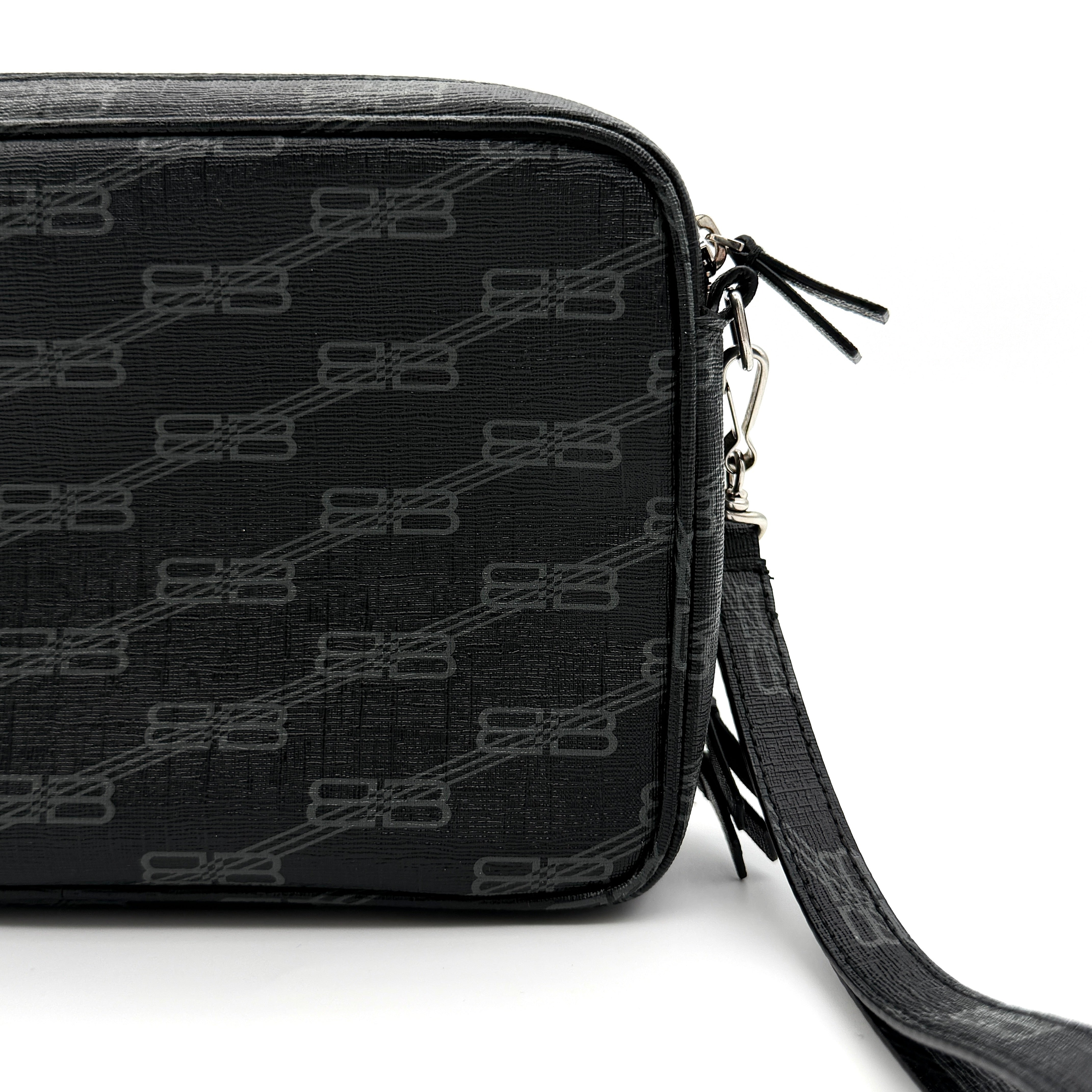 Balenciaga Signature BB Monogram Everyday Clutch Bag in black with double zip compartments and detachable wrist strap displayed on a Balenciaga dust bag.