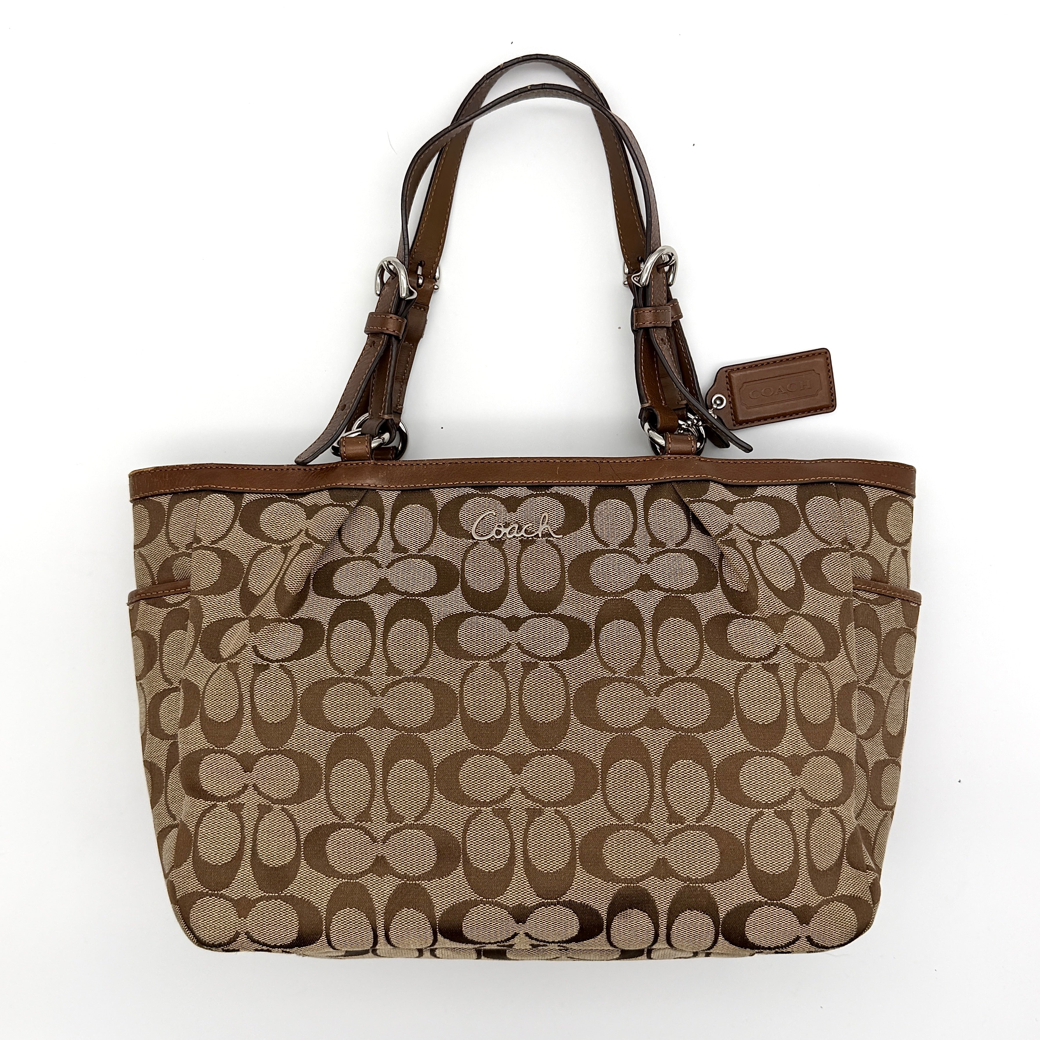 Coach Signature Gallery Tote Bag in beige and brown with double leather handles and the iconic logo pattern.
