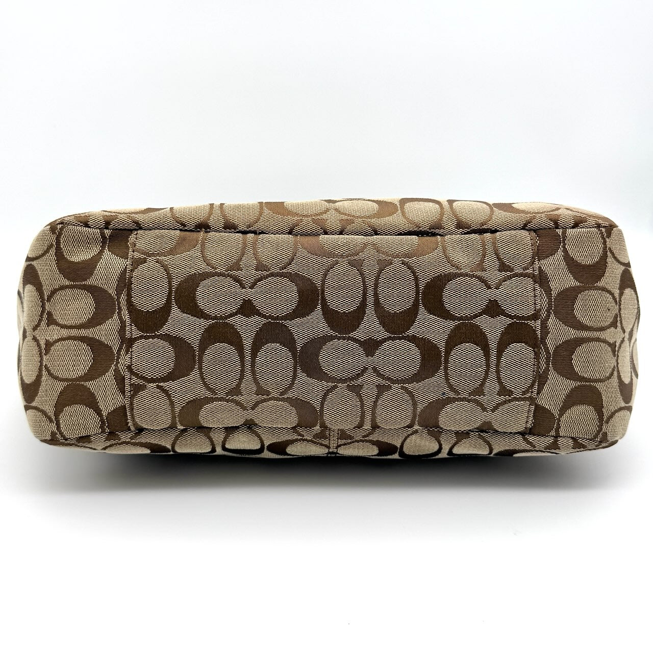 Coach Signature Gallery Tote Bag in beige and brown with double leather handles and the iconic logo pattern.