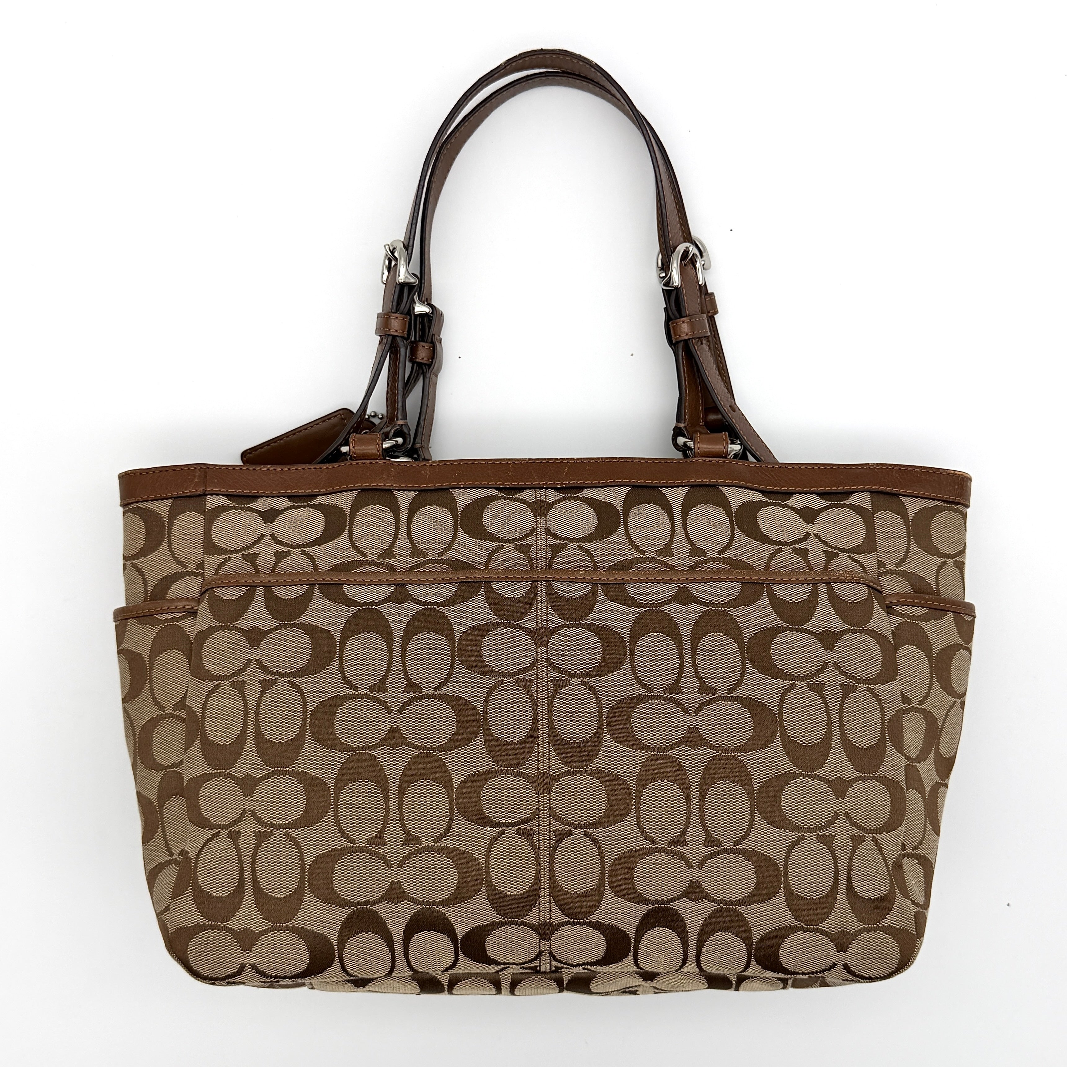 Coach Signature Gallery Tote Bag in beige and brown with double leather handles and the iconic logo pattern.