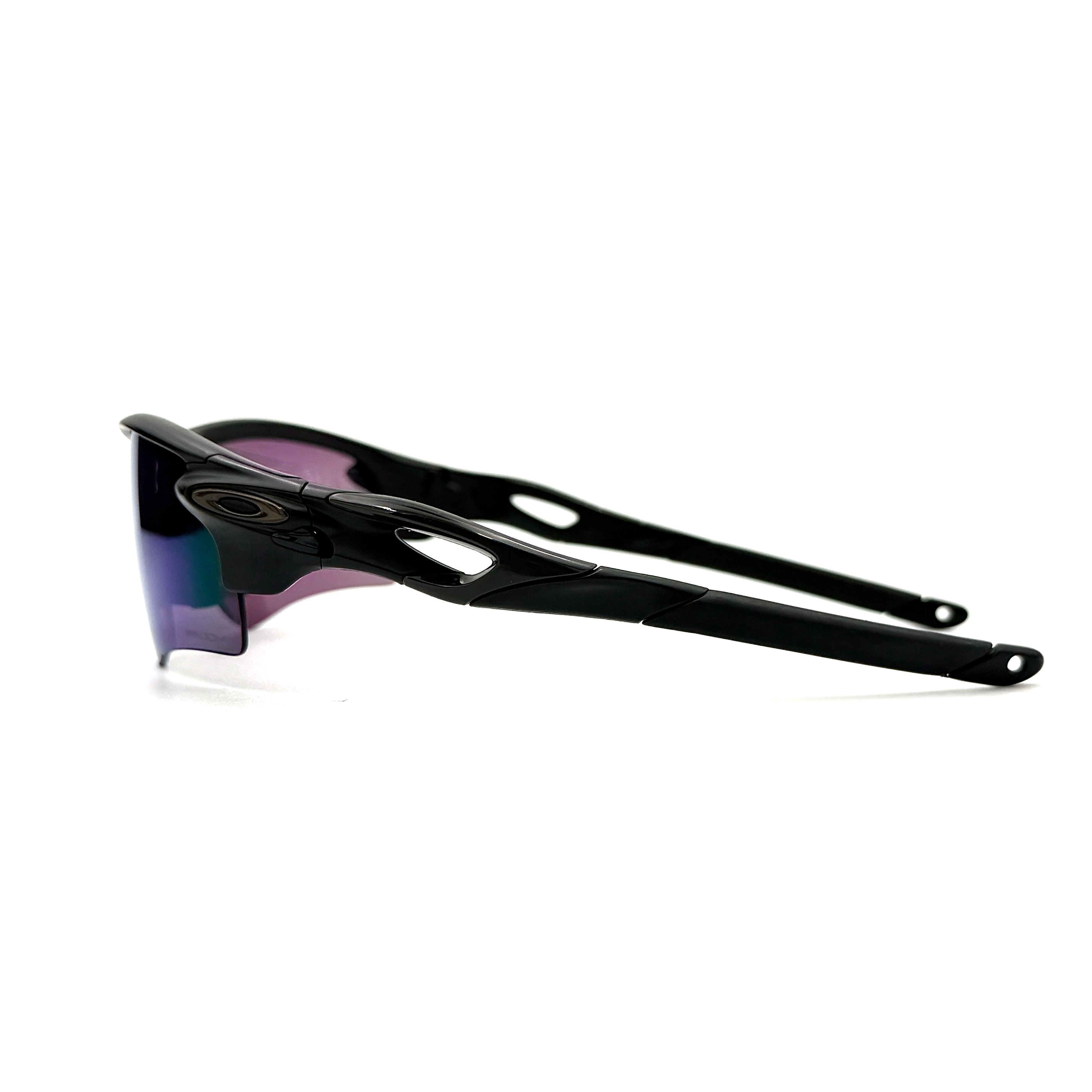 Oakley RadarLock Path sunglasses in matte black with reflective green and violet Prizm shield lens, presented with original black case, box, and cloth.