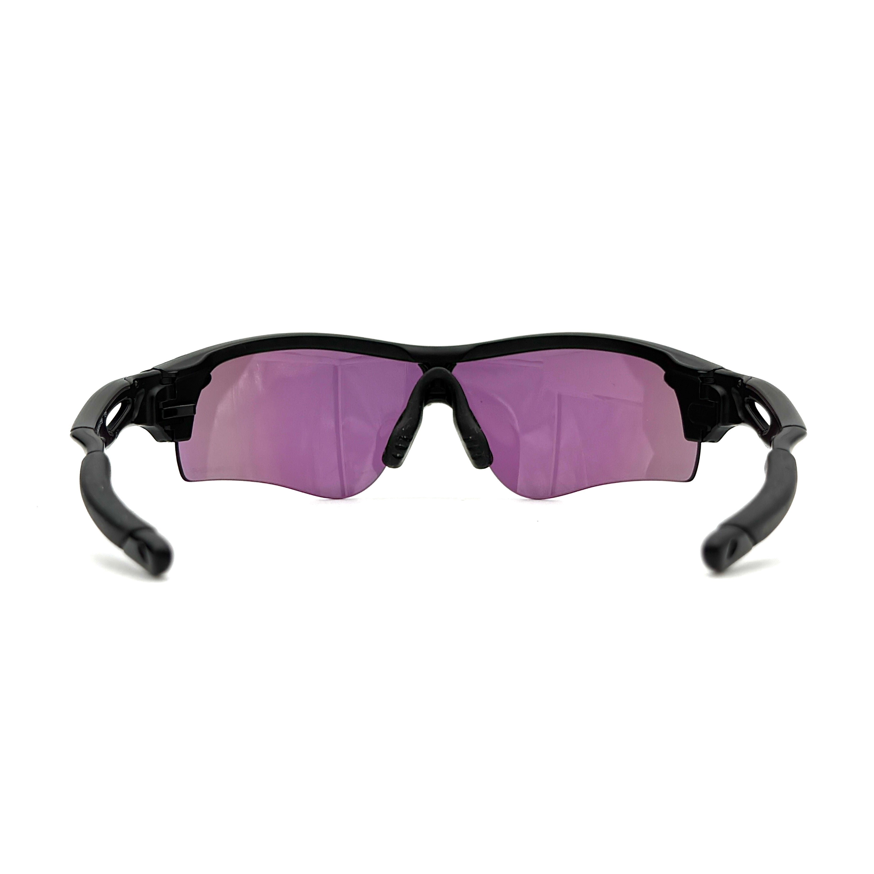 Oakley RadarLock Path sunglasses in matte black with reflective green and violet Prizm shield lens, presented with original black case, box, and cloth.
