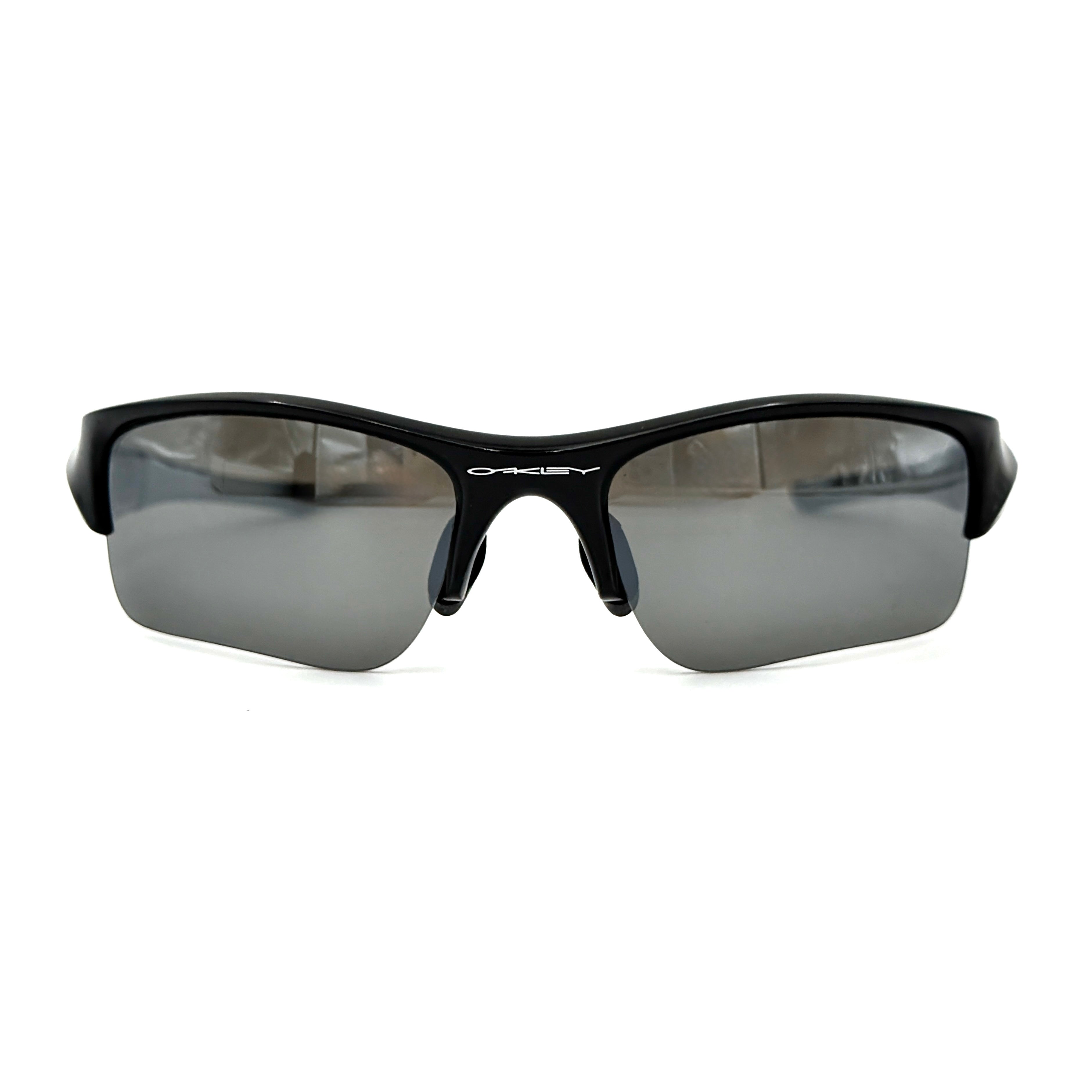 Oakley FLAK Jacket 03-915 sunglasses in black with grey lenses, shown with original zip case.