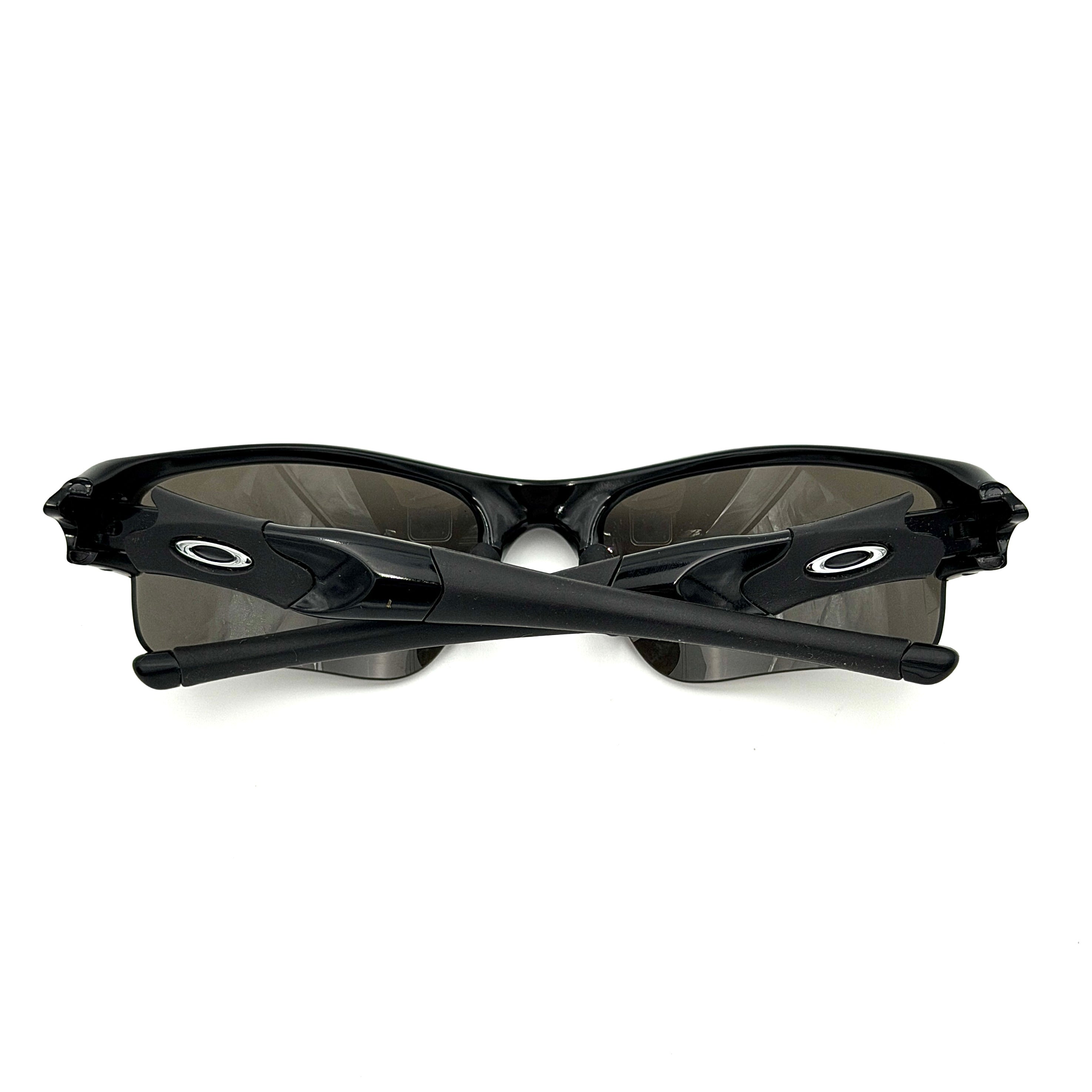 Oakley FLAK Jacket 03-915 sunglasses in black with grey lenses, shown with original zip case.