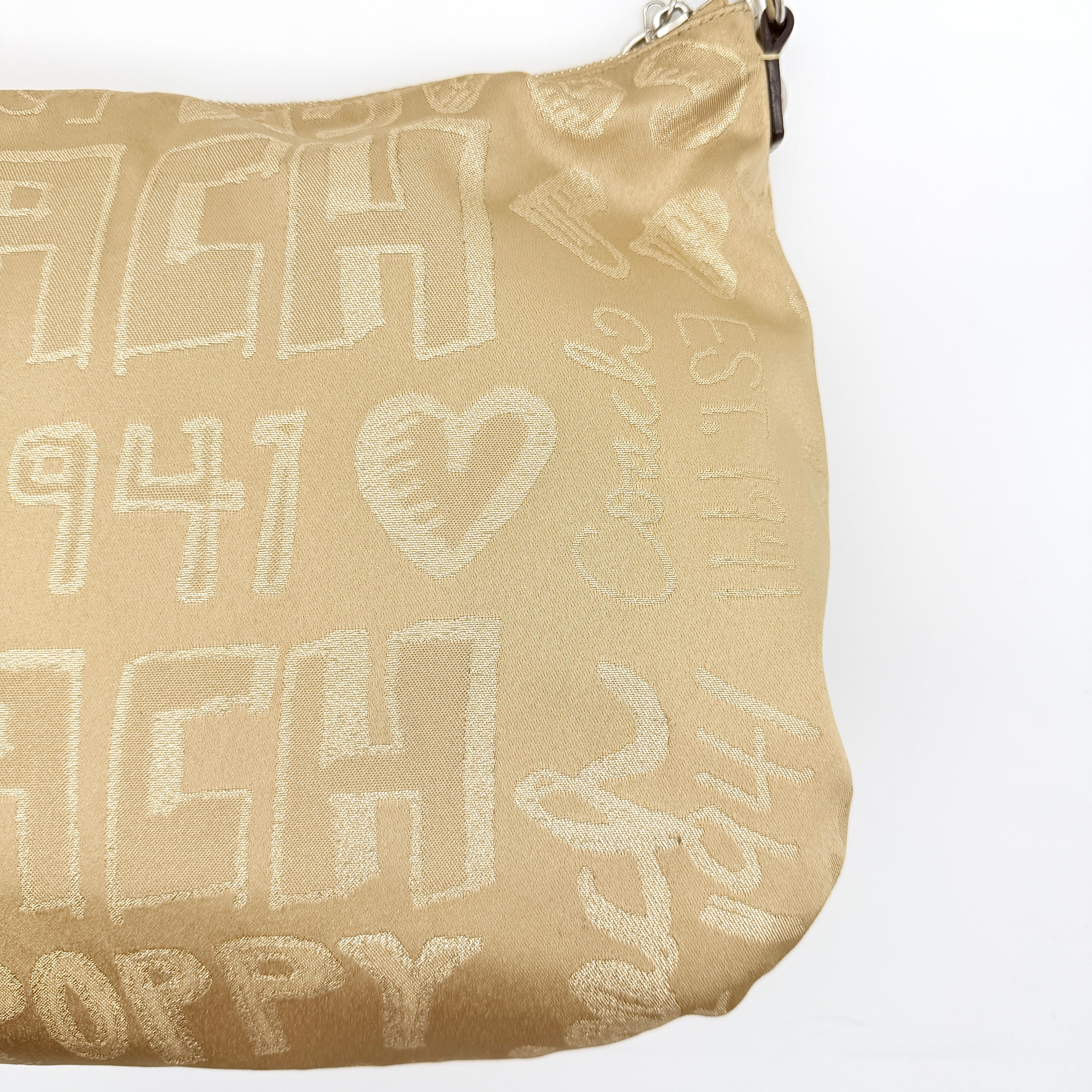 Coach Signature Poppy Pocket Hobo in beige sateen with metallic gold trim and silver hardware, shown with detachable strap.