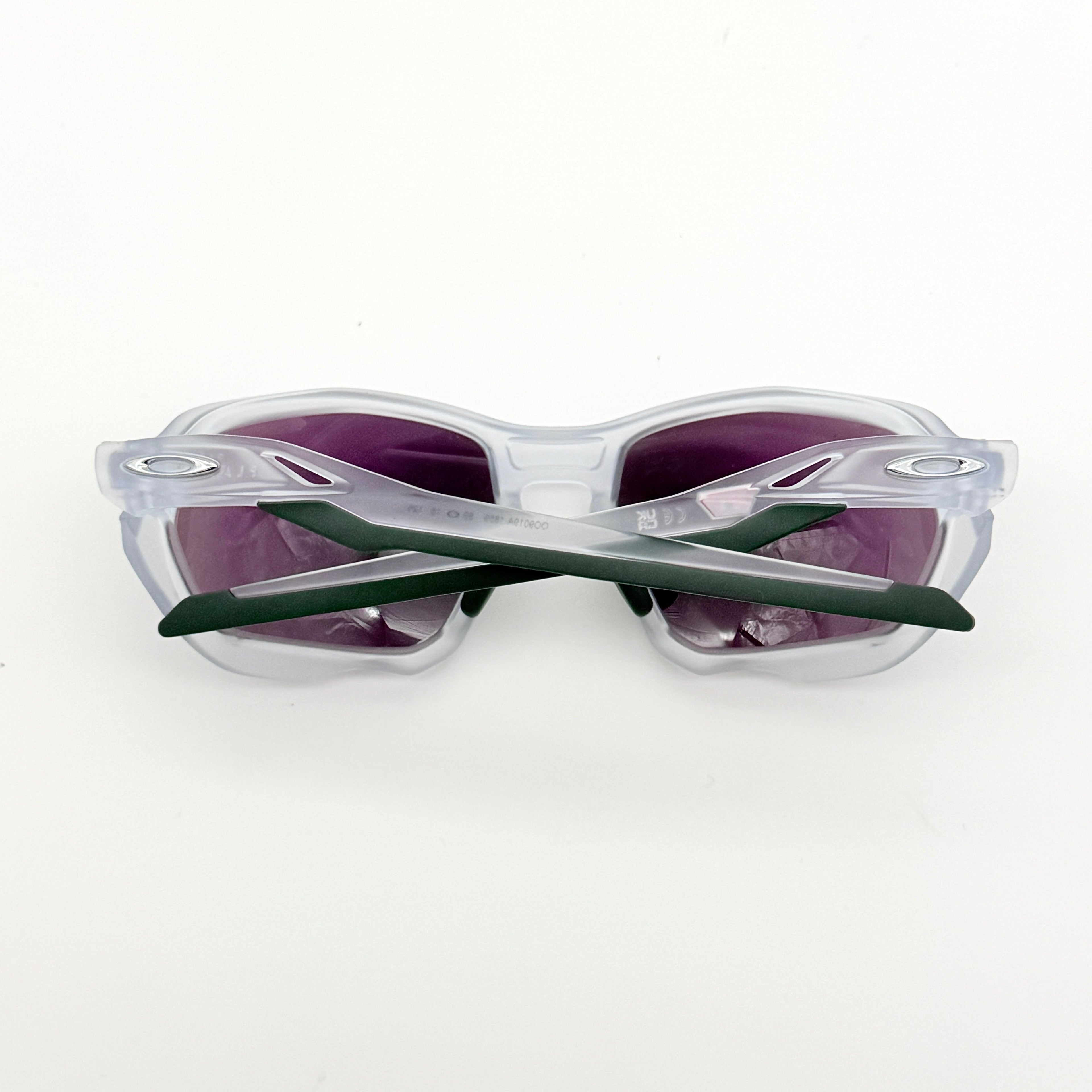 Oakley Plazma sunglasses in matte clear with Prizm Jade Road lenses, shown with original case and box.