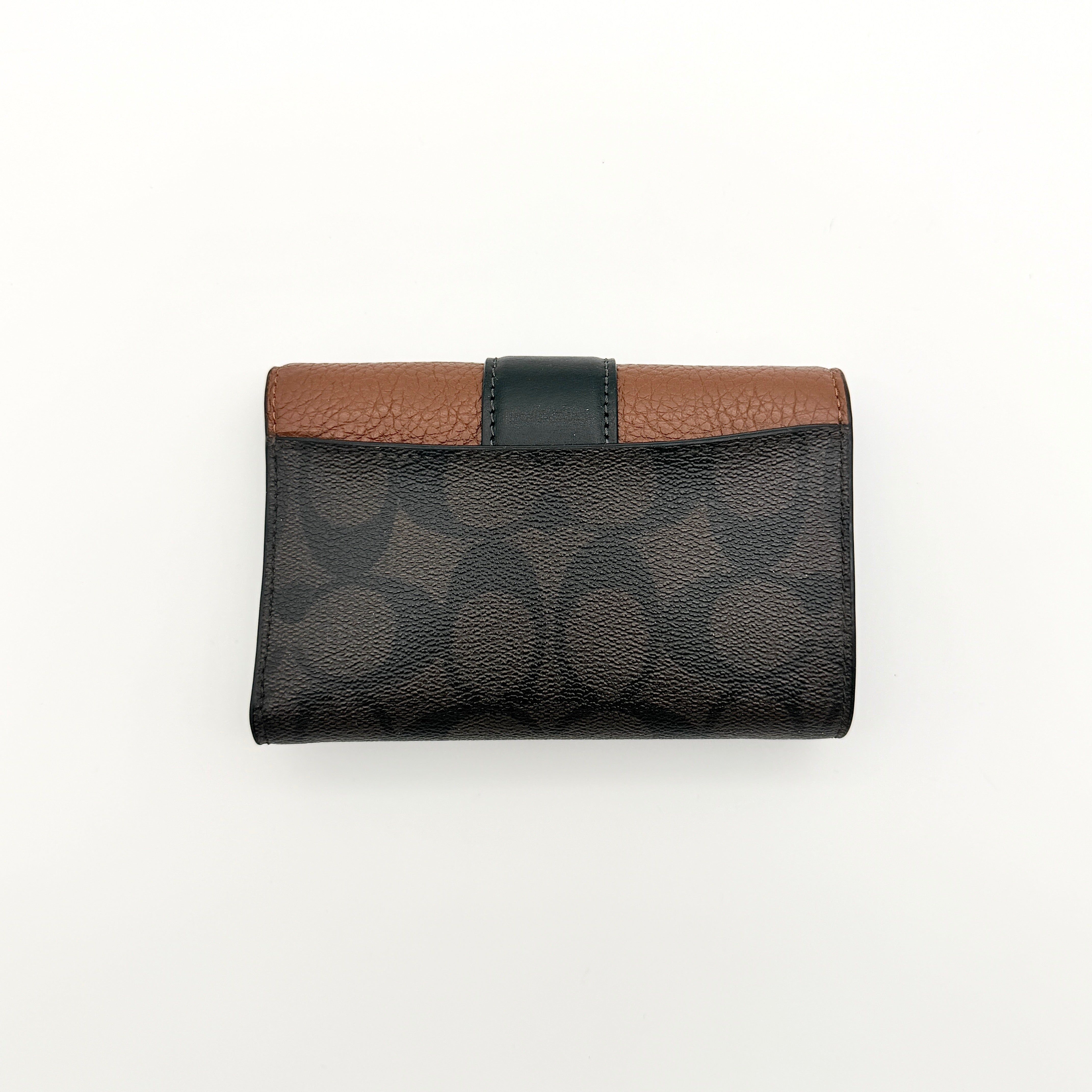 Coach Signature Medium Grace Wallet in brown and black with gold-tone carriage logo on the front.