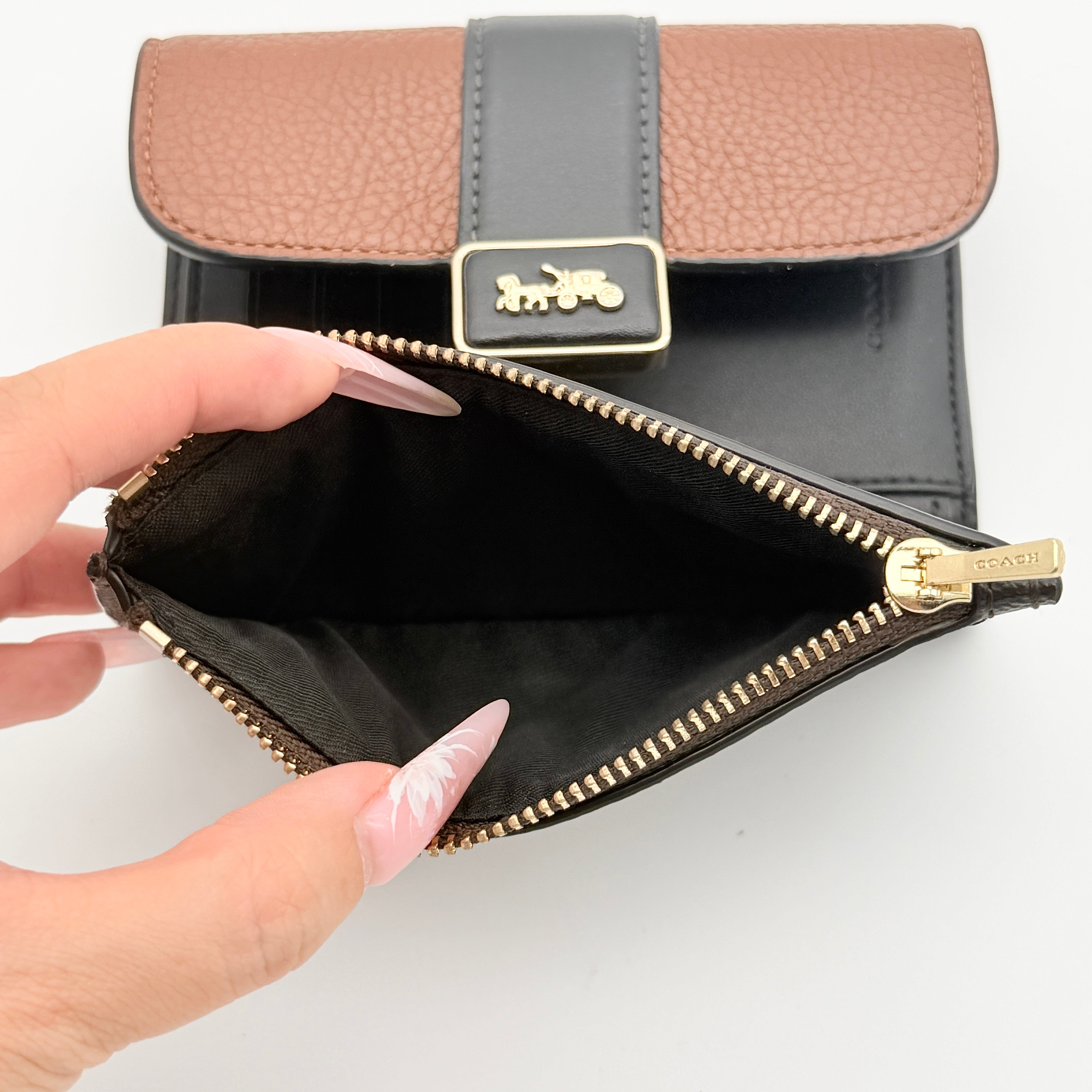 Coach Signature Medium Grace Wallet in brown and black with gold-tone carriage logo on the front.