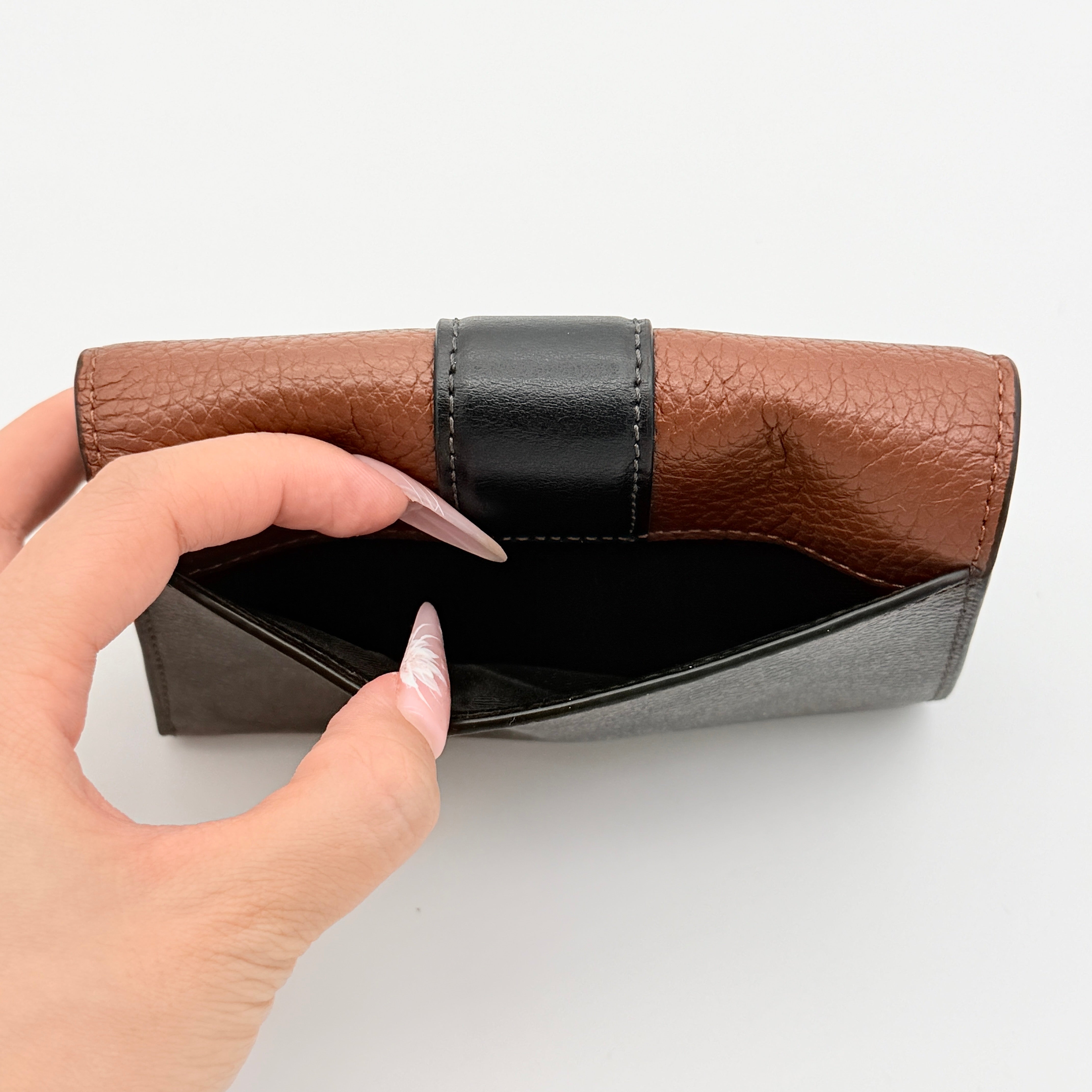 Coach Signature Medium Grace Wallet in brown and black with gold-tone carriage logo on the front.