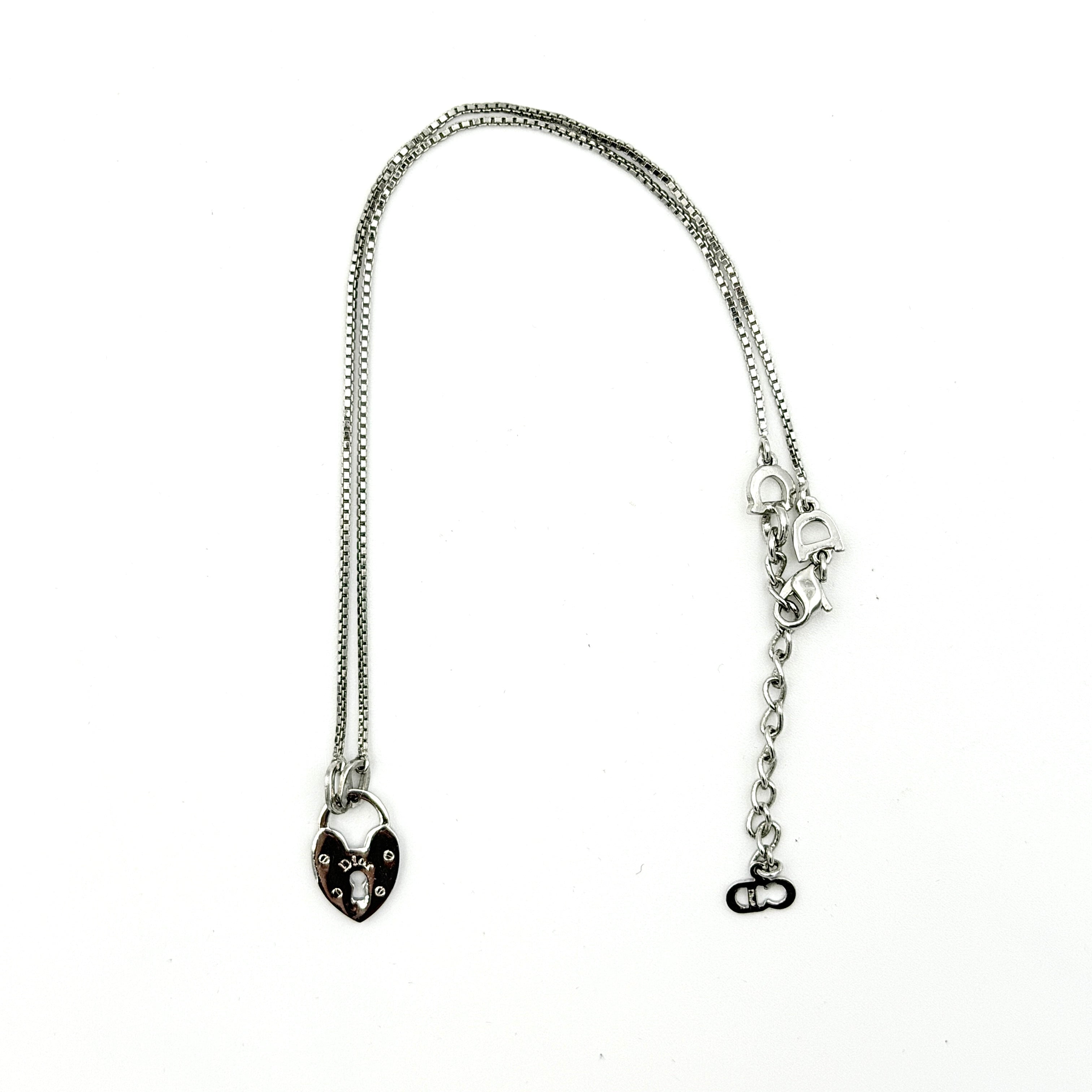 Dior Heart Padlock Necklace in polished silver-tone metal, featuring a heart-shaped padlock pendant on a slender box chain.