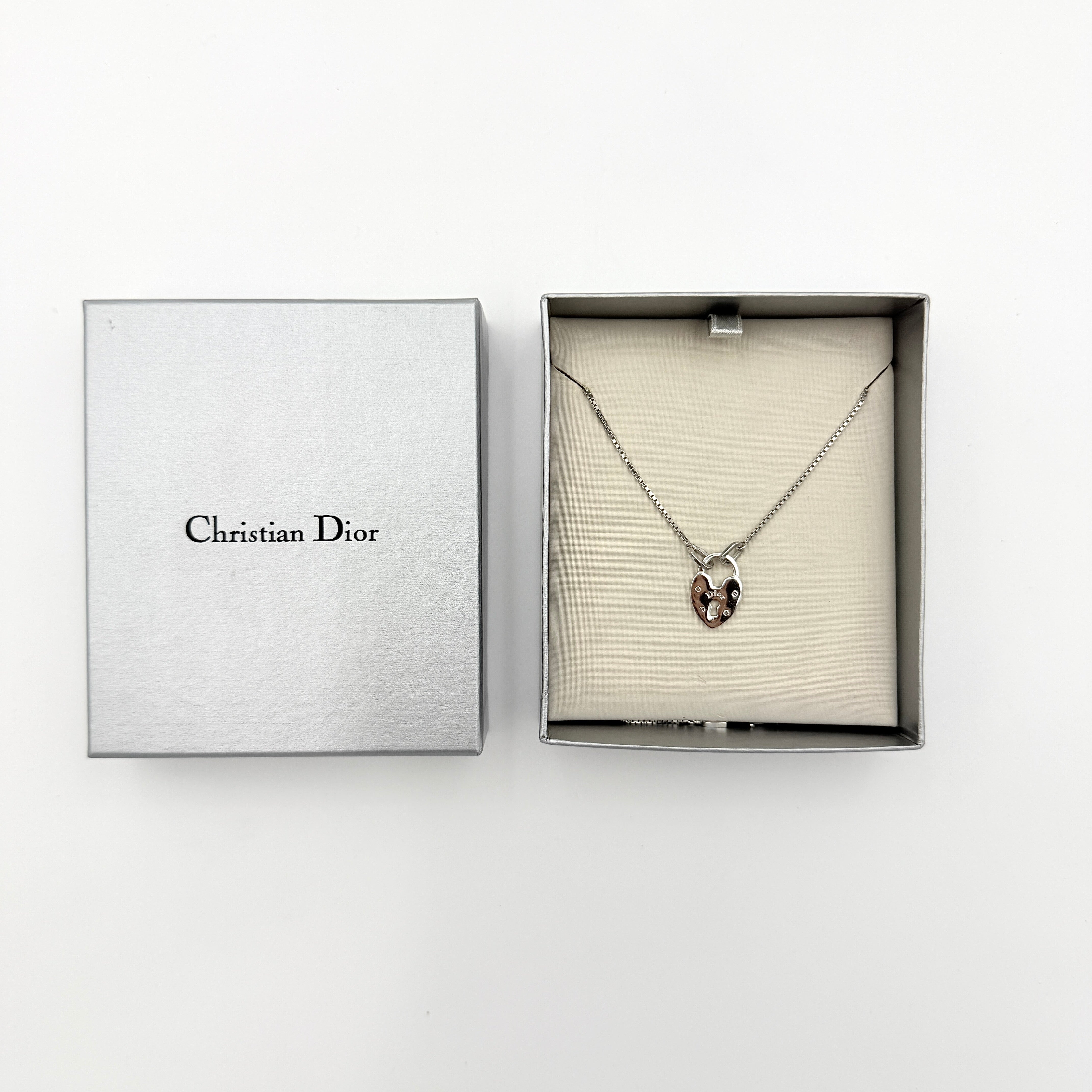 Dior Heart Padlock Necklace in polished silver-tone metal, featuring a heart-shaped padlock pendant on a slender box chain.