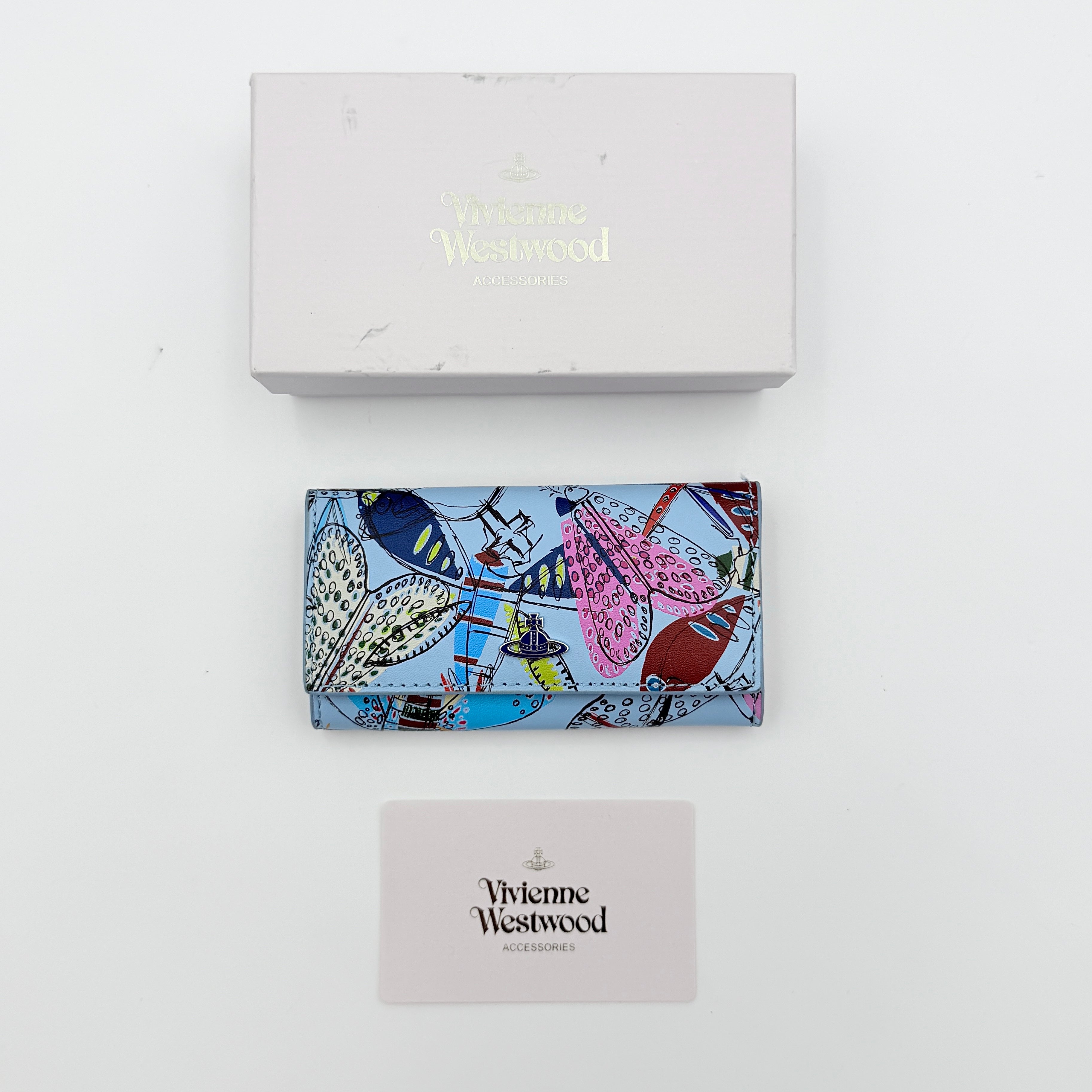 Vivienne Westwood Messy Bugs Key Holder in baby blue leather with a colourful insect motif and silver orb hardware.