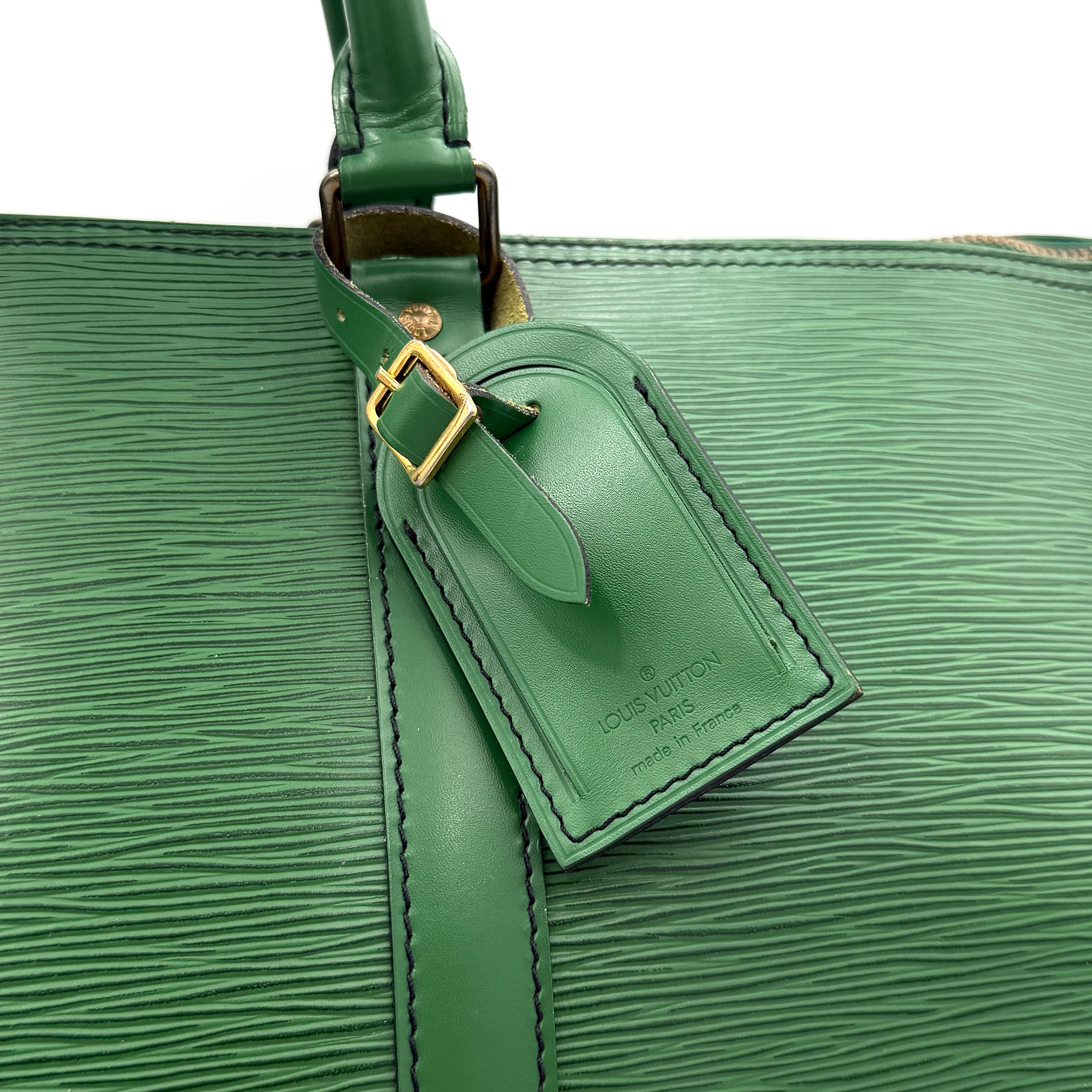 Louis Vuitton Epi Keepall 60 Duffle Bag in textured green leather with double handles and gold-tone hardware.