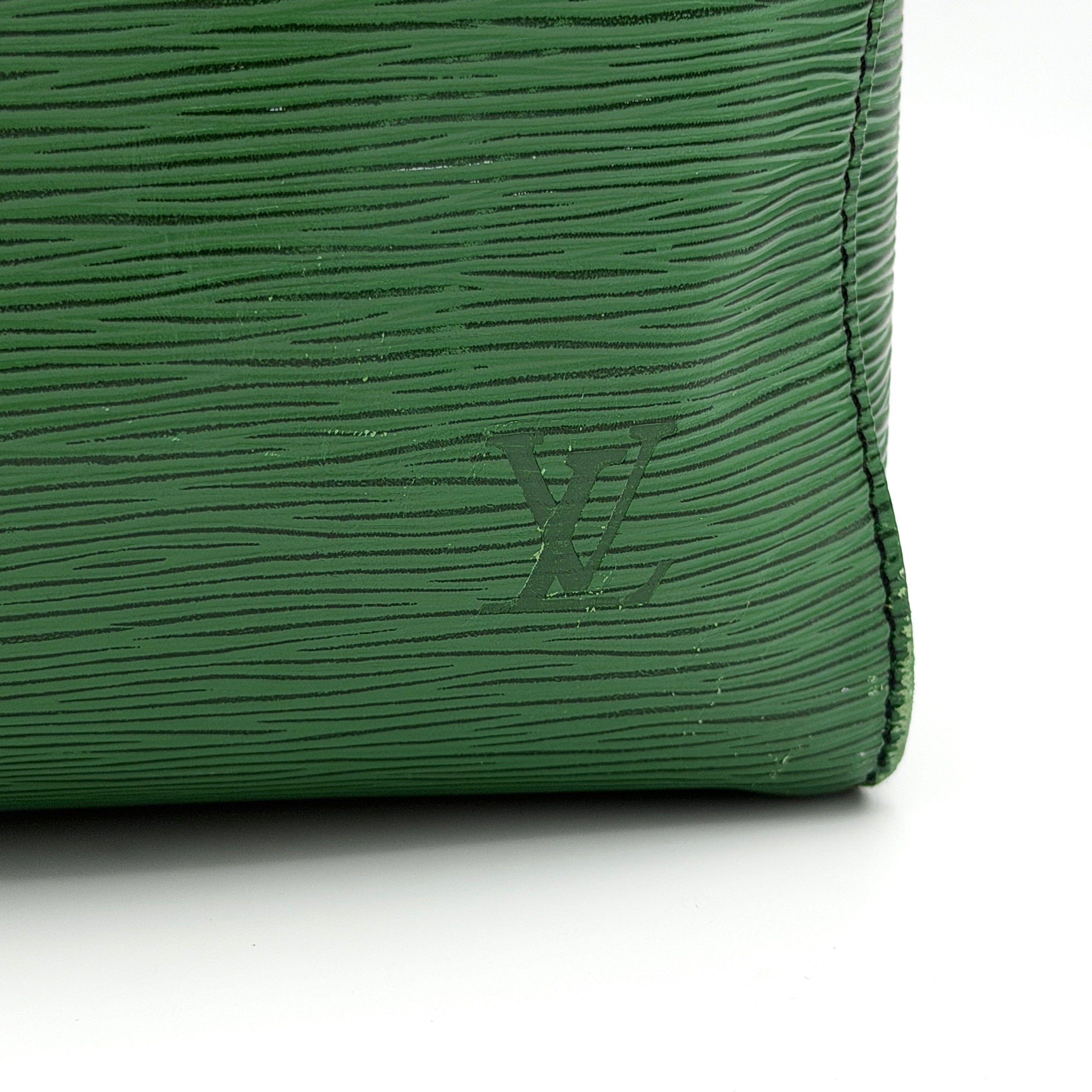 Louis Vuitton Epi Keepall 60 Duffle Bag in textured green leather with double handles and gold-tone hardware.