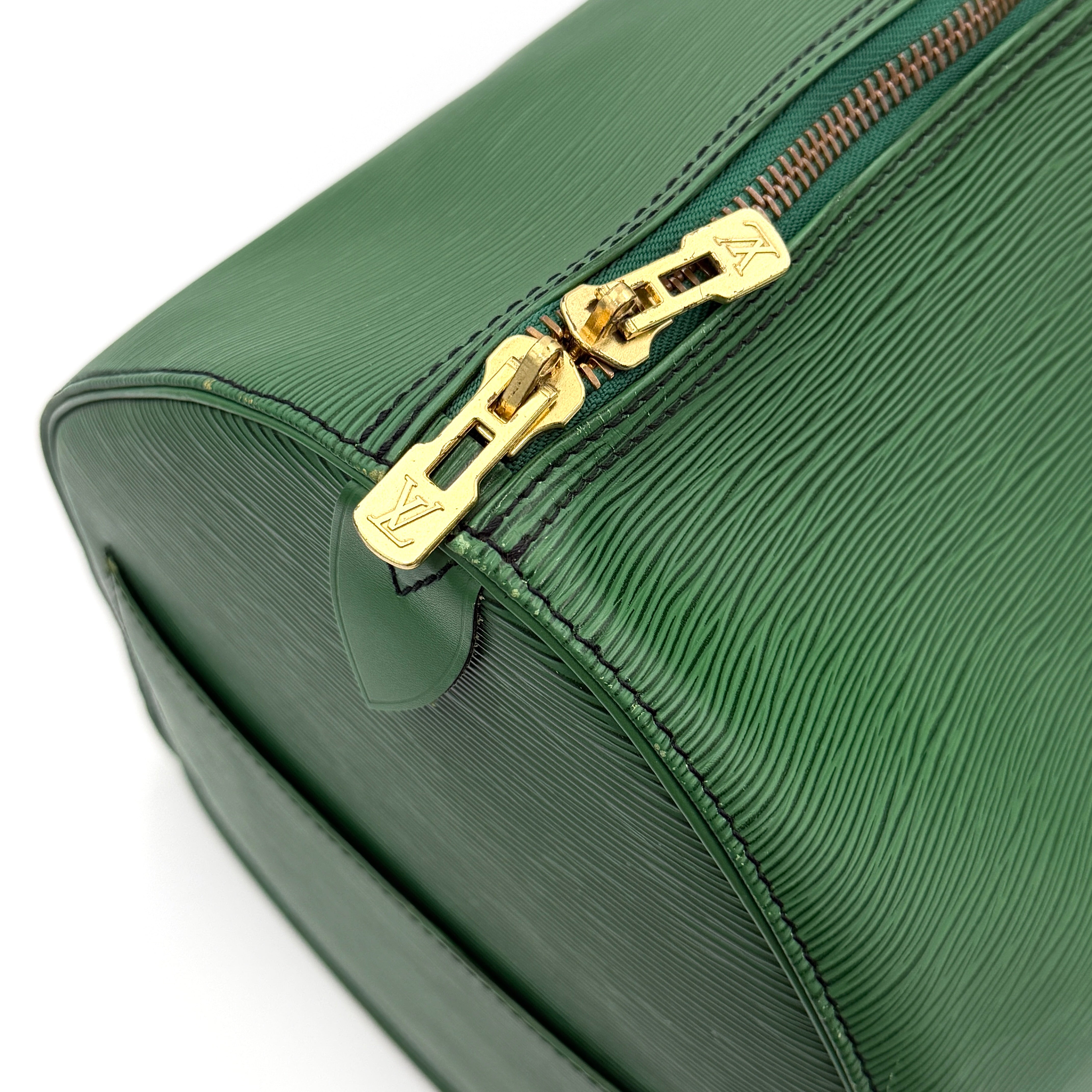 Louis Vuitton Epi Keepall 60 Duffle Bag in textured green leather with double handles and gold-tone hardware.