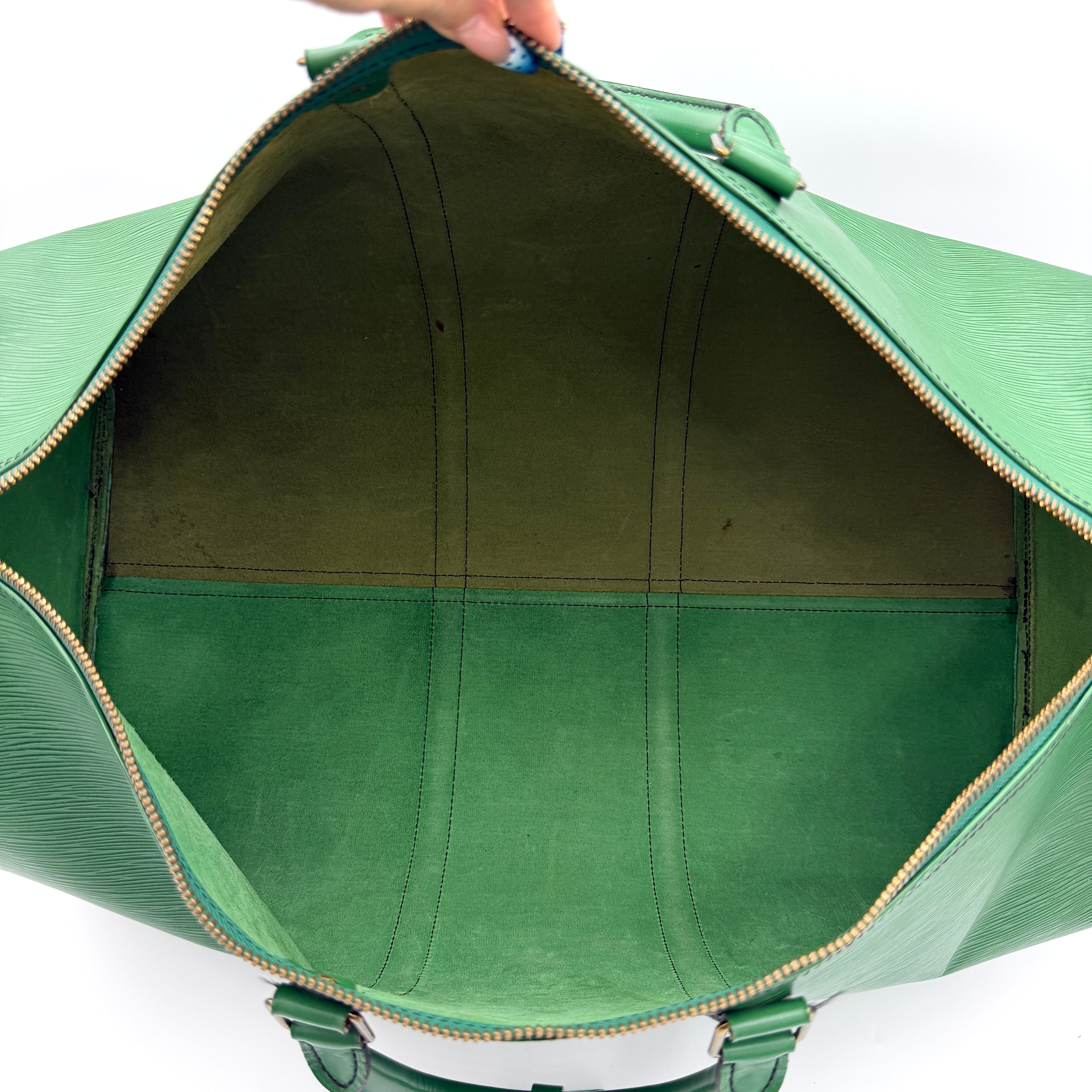 Louis Vuitton Epi Keepall 60 Duffle Bag in textured green leather with double handles and gold-tone hardware.