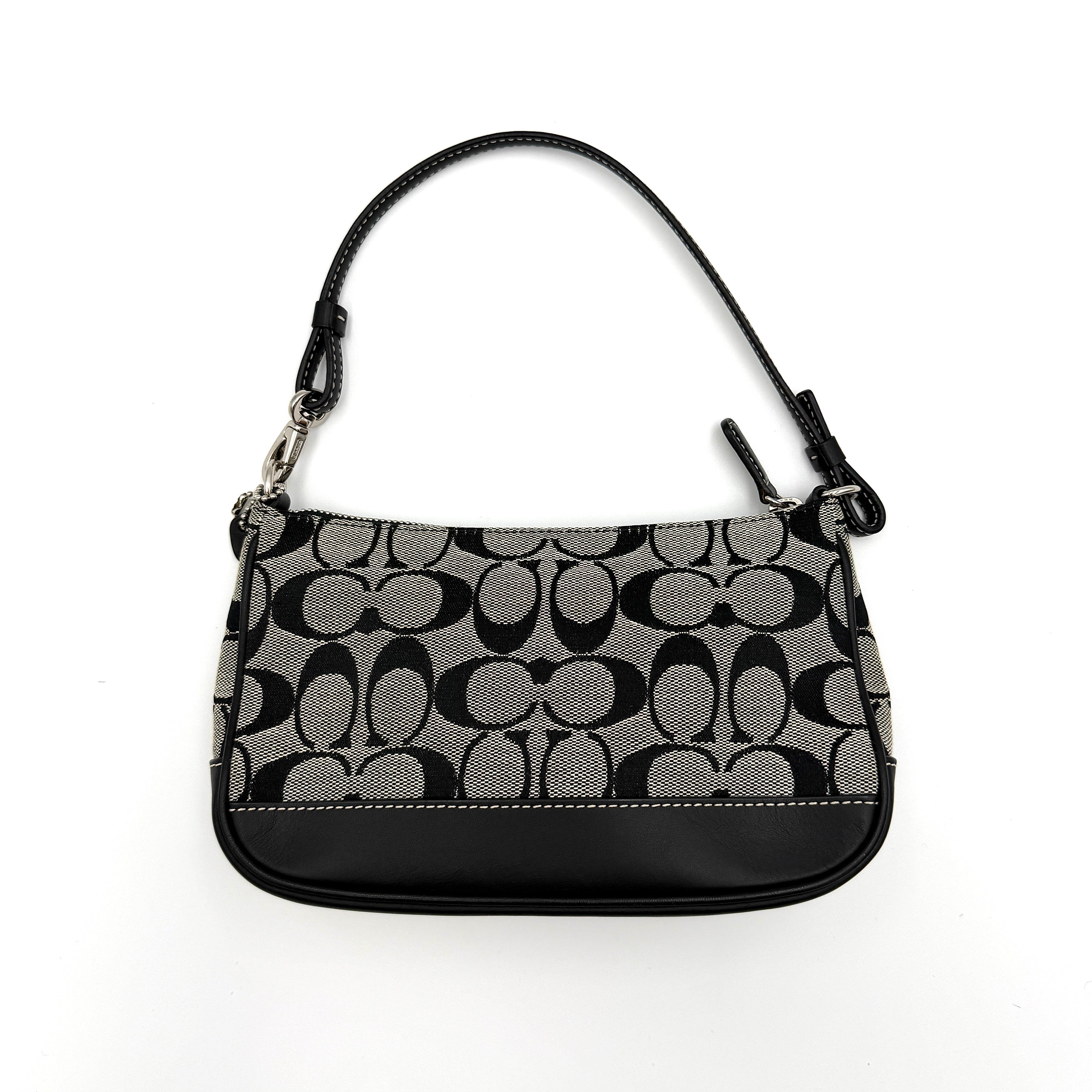 Coach Y2K Demi Shoulder Bag in black and grey monogram canvas with leather trim and a structured silhouette.